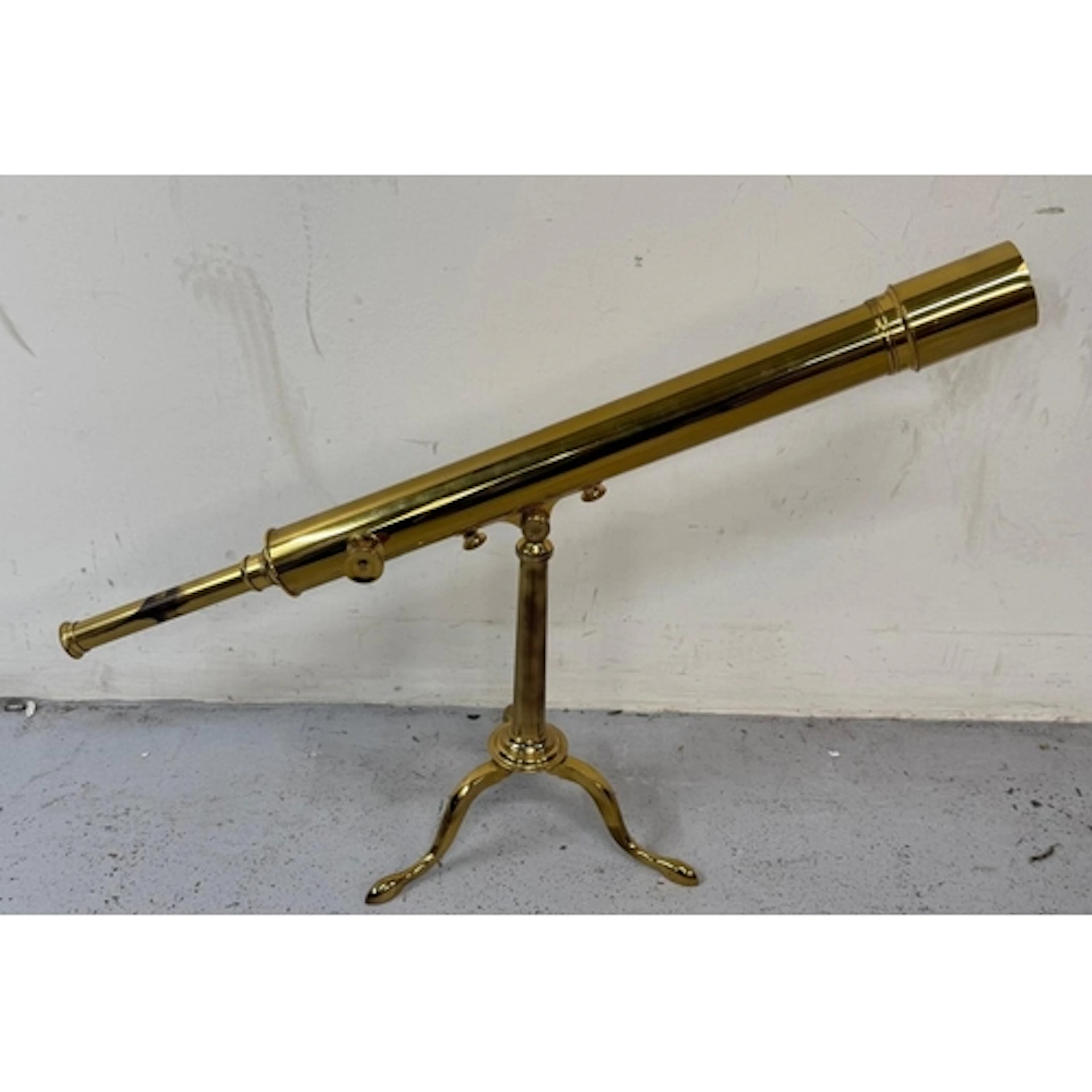 Brass telescope, by Watson and Sons, London. The table o...