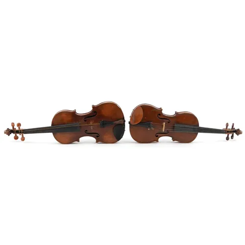 Two old wooden violins with cases, one an bearing an Antoniu...