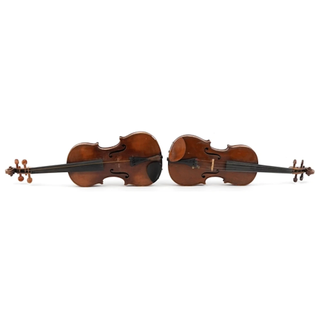 Two old wooden violins with cases, one an bearing an Antoniu...