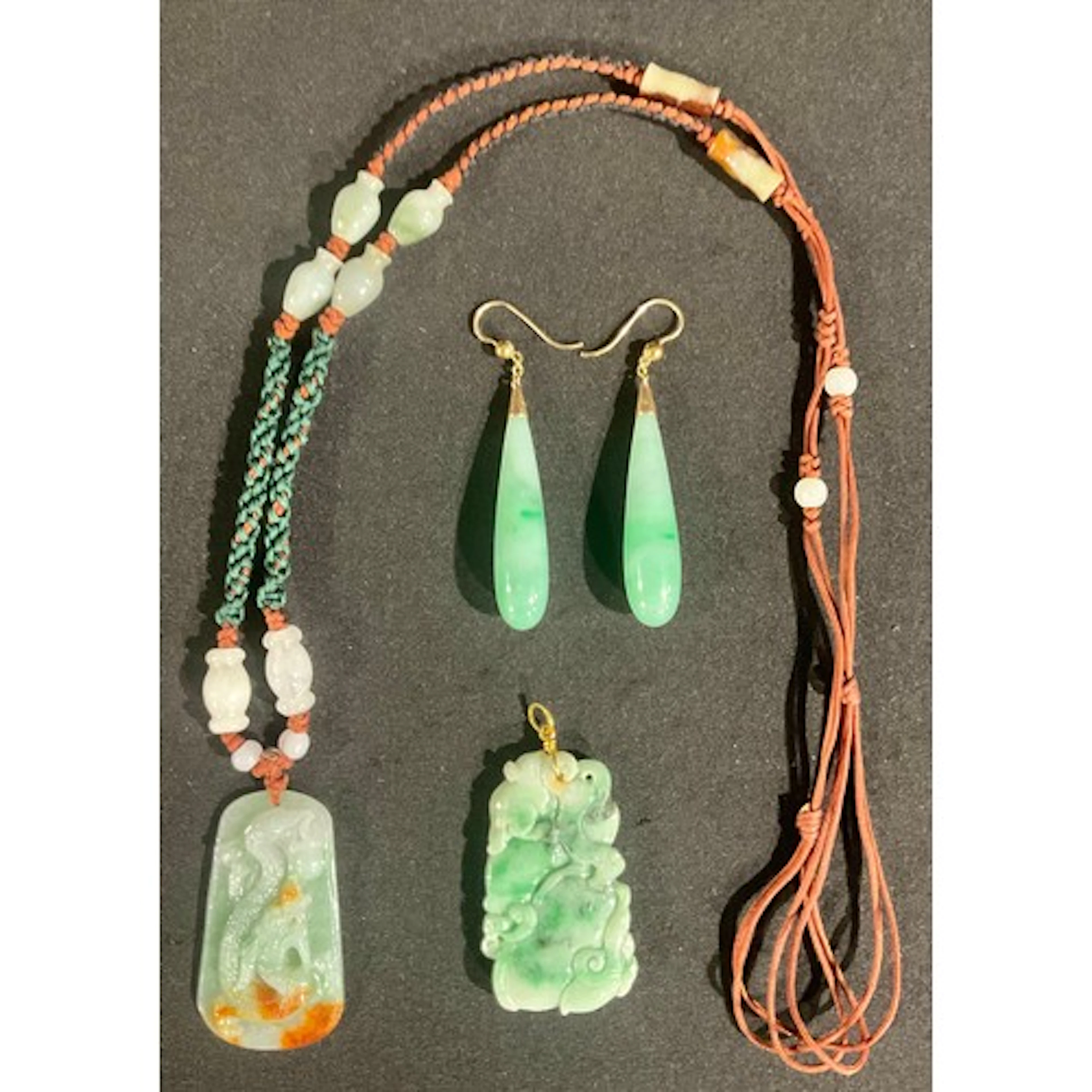 A Chinese carved green stone tablet pendant necklace, as a ...