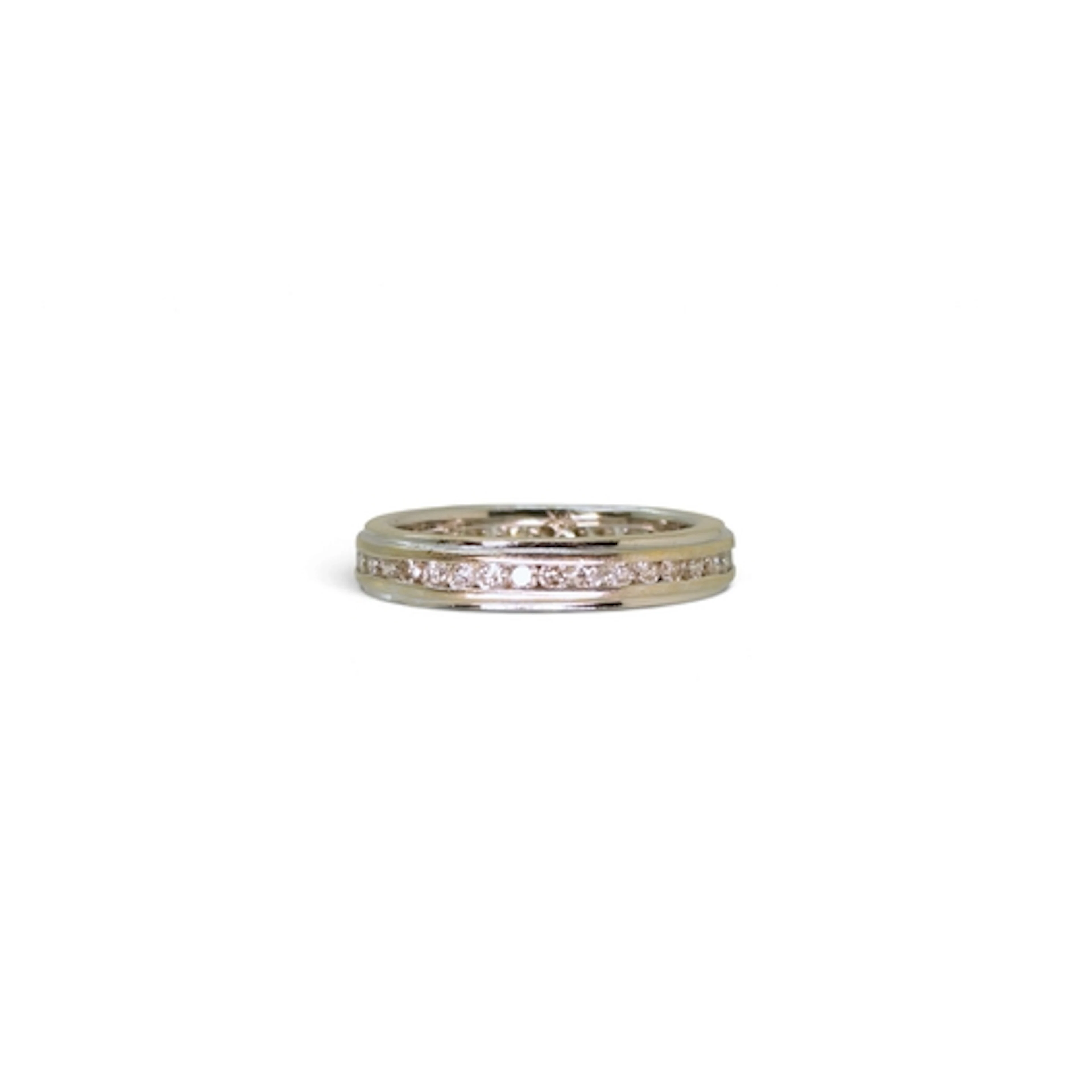 An 18ct white gold full eternity ring, size n, weight 4.6gms