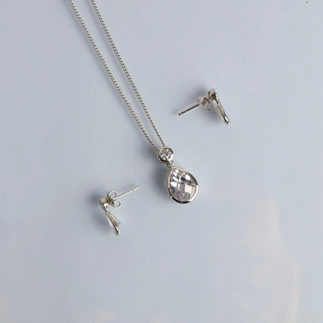 A suite of 9ct white gold mounted dress jewellery, including...