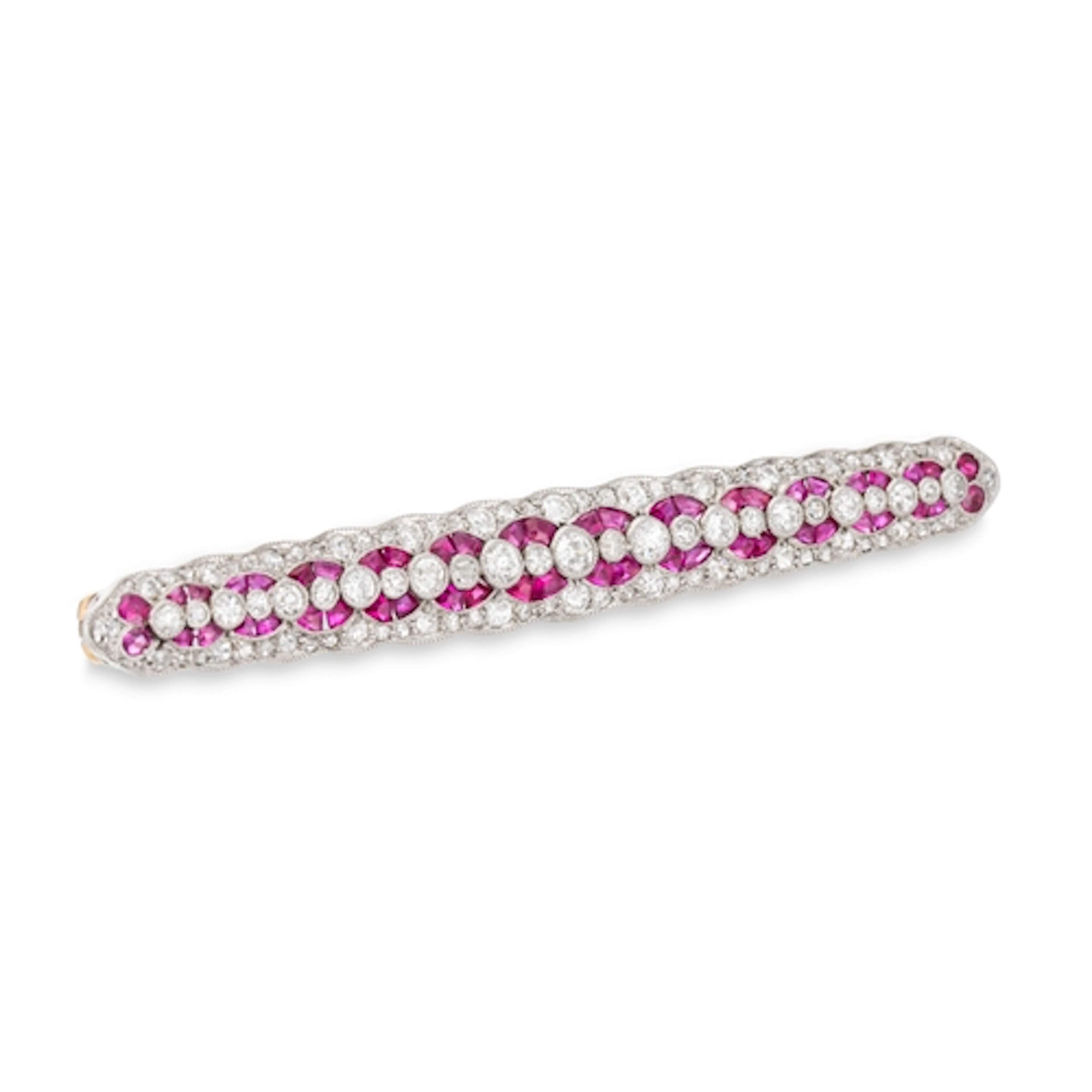 AN EARLY 20TH CENTURY RUBY AND DIAMOND GEOMETRIC ELONGATED B...