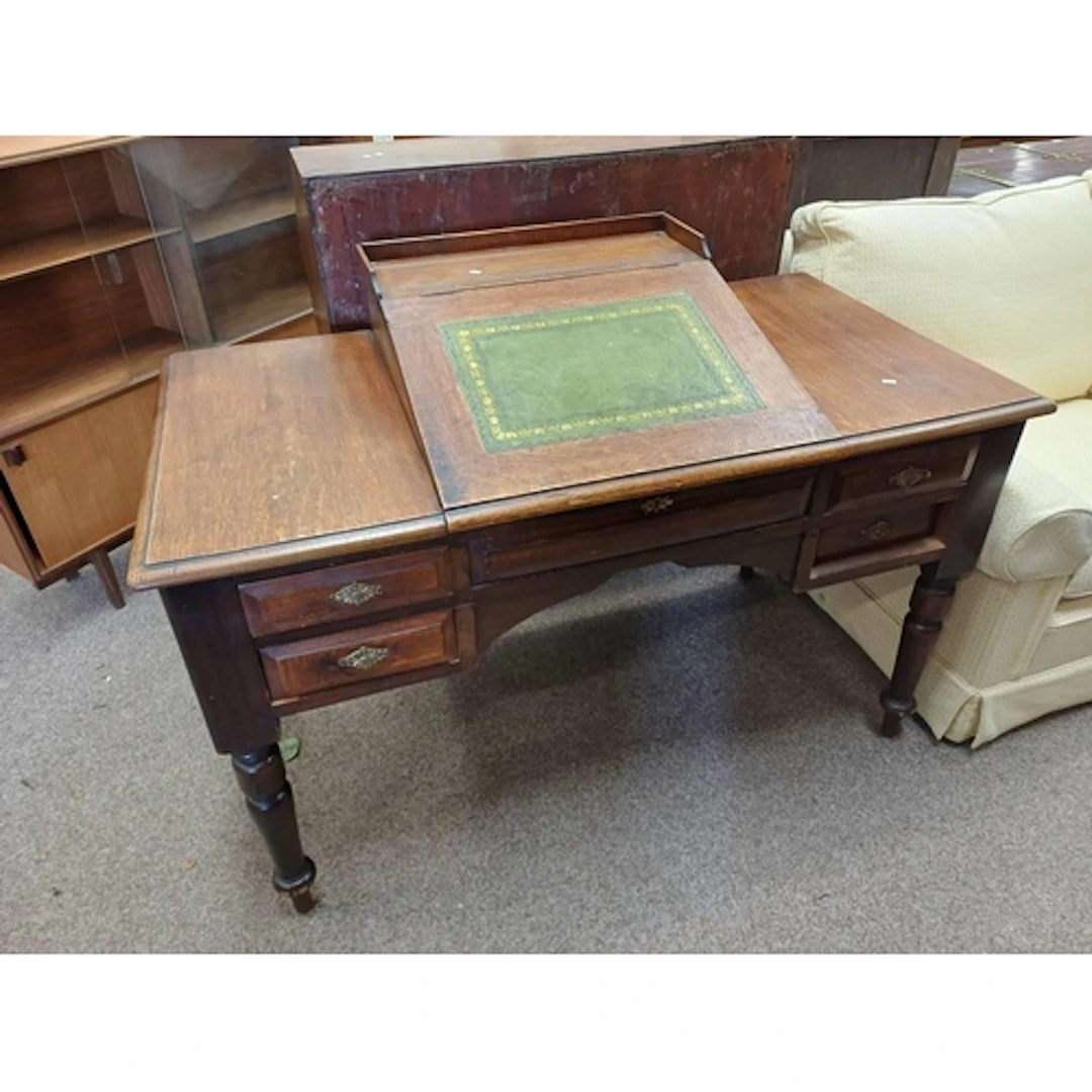 LATE 19TH OR EARLY 20TH CENTURY OAK WRITING DESK. THE CENTRA...
