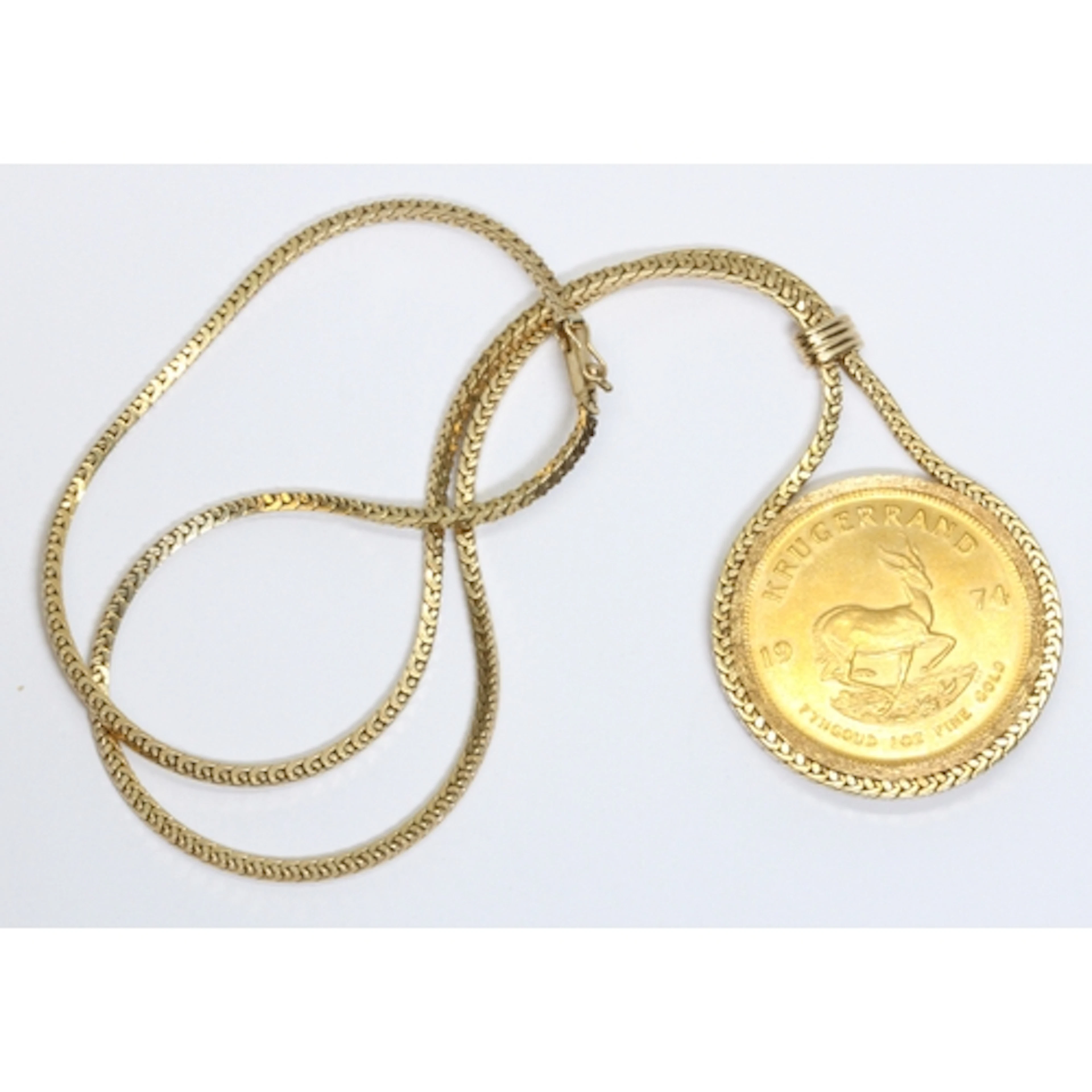 A 9ct gold mounted Krugerrand pendant necklace, chain length...