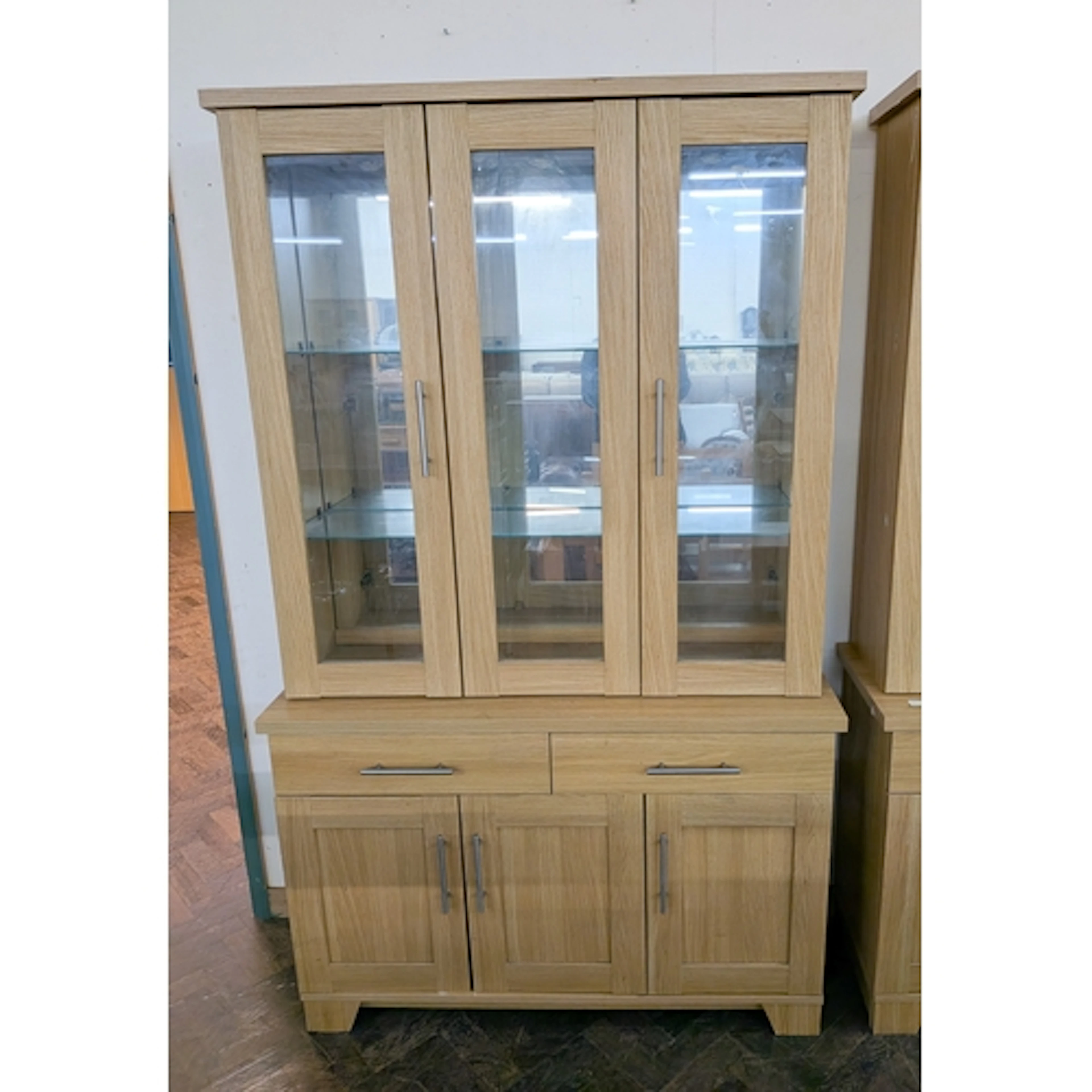 Modern light oak finished wall display cabinet, three glazed...
