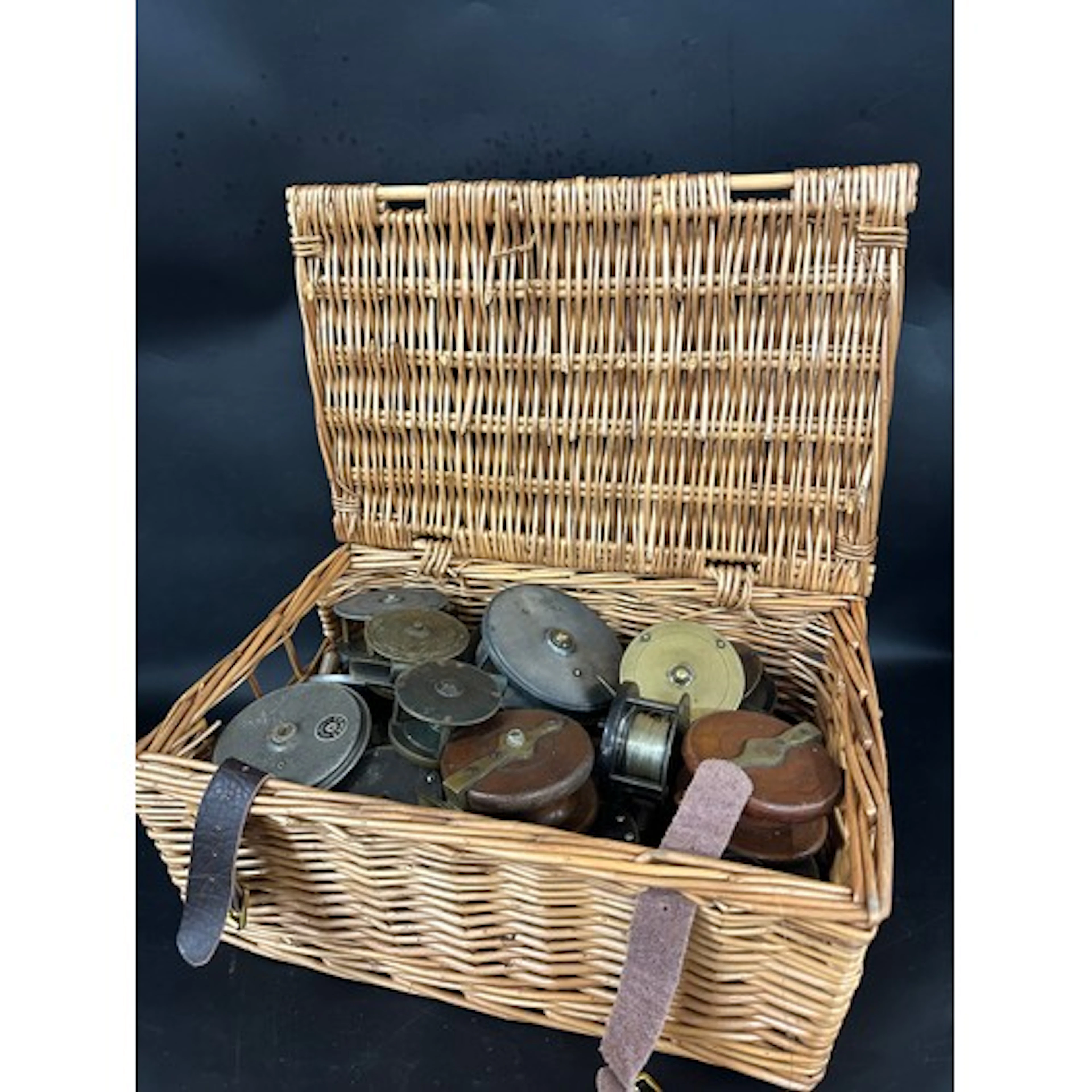 A large collection of antique and vintage fishing reels, bra...