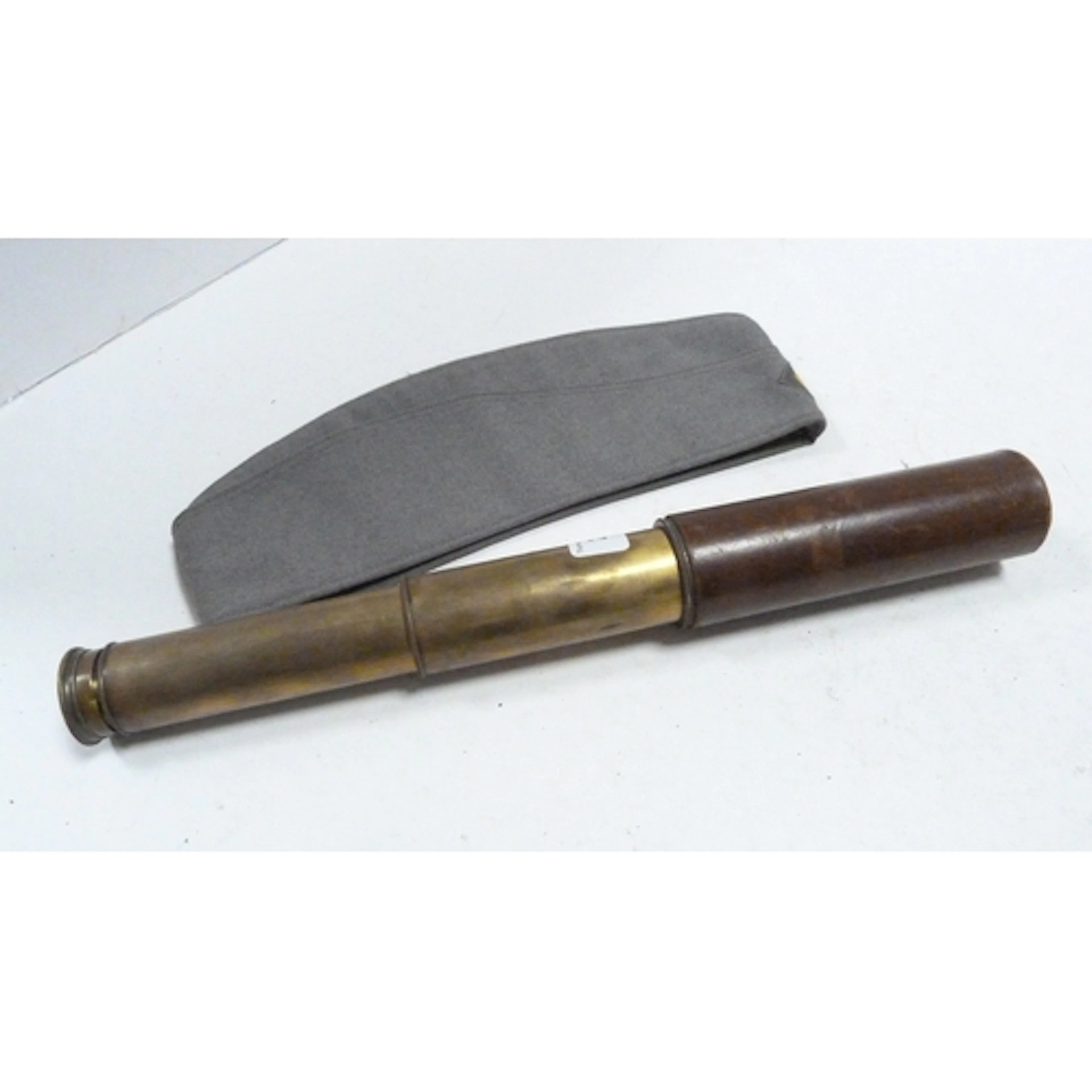 Antique brass two-draw telescope with tooled grip and a West...