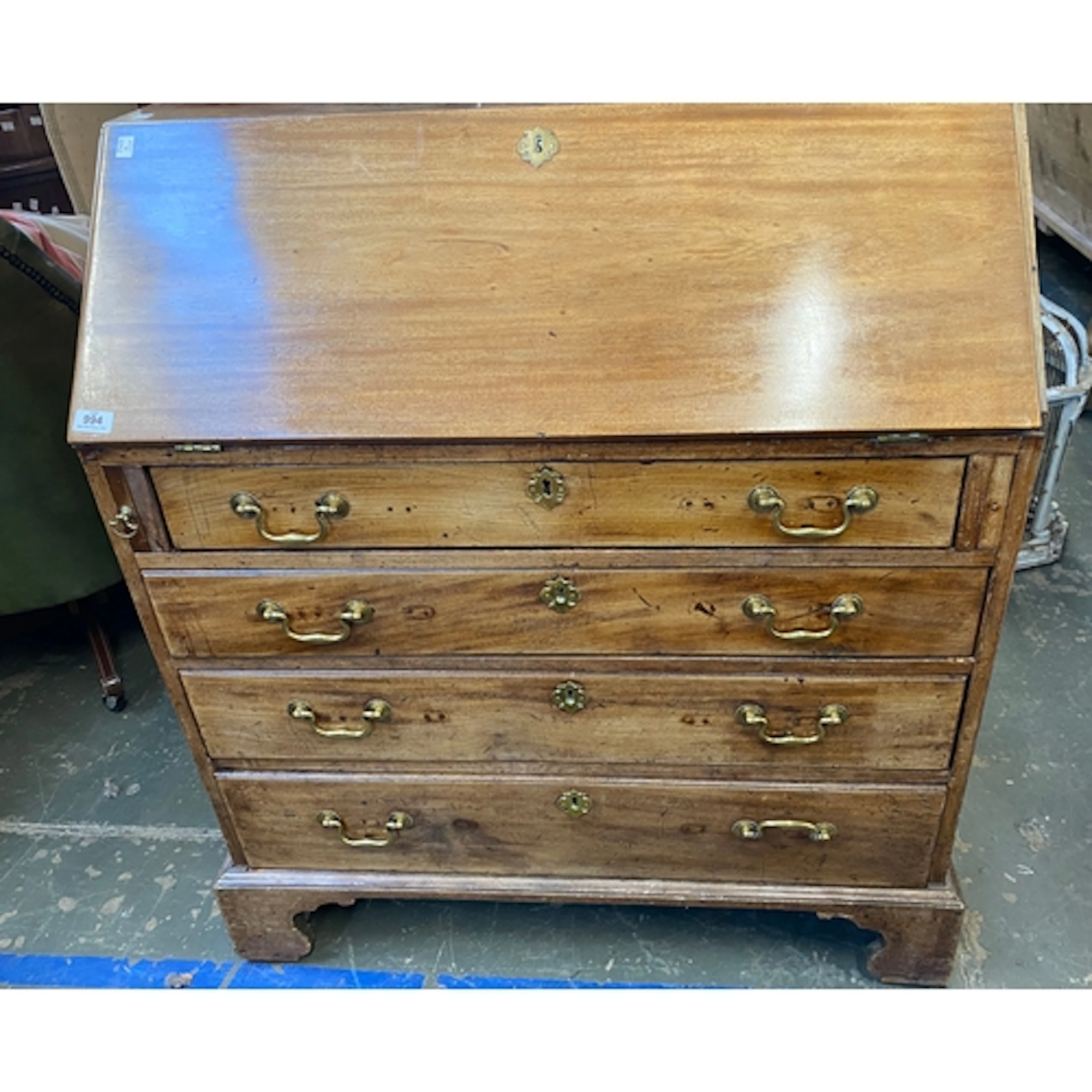 A George III mahogany bureau, the fall front opening to a fi...