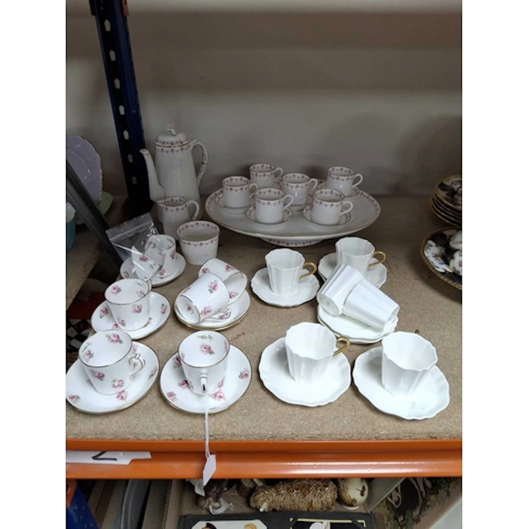 A GROUP OF THREE VINTAGE COFFEE SETS comprising a Royal Worc...