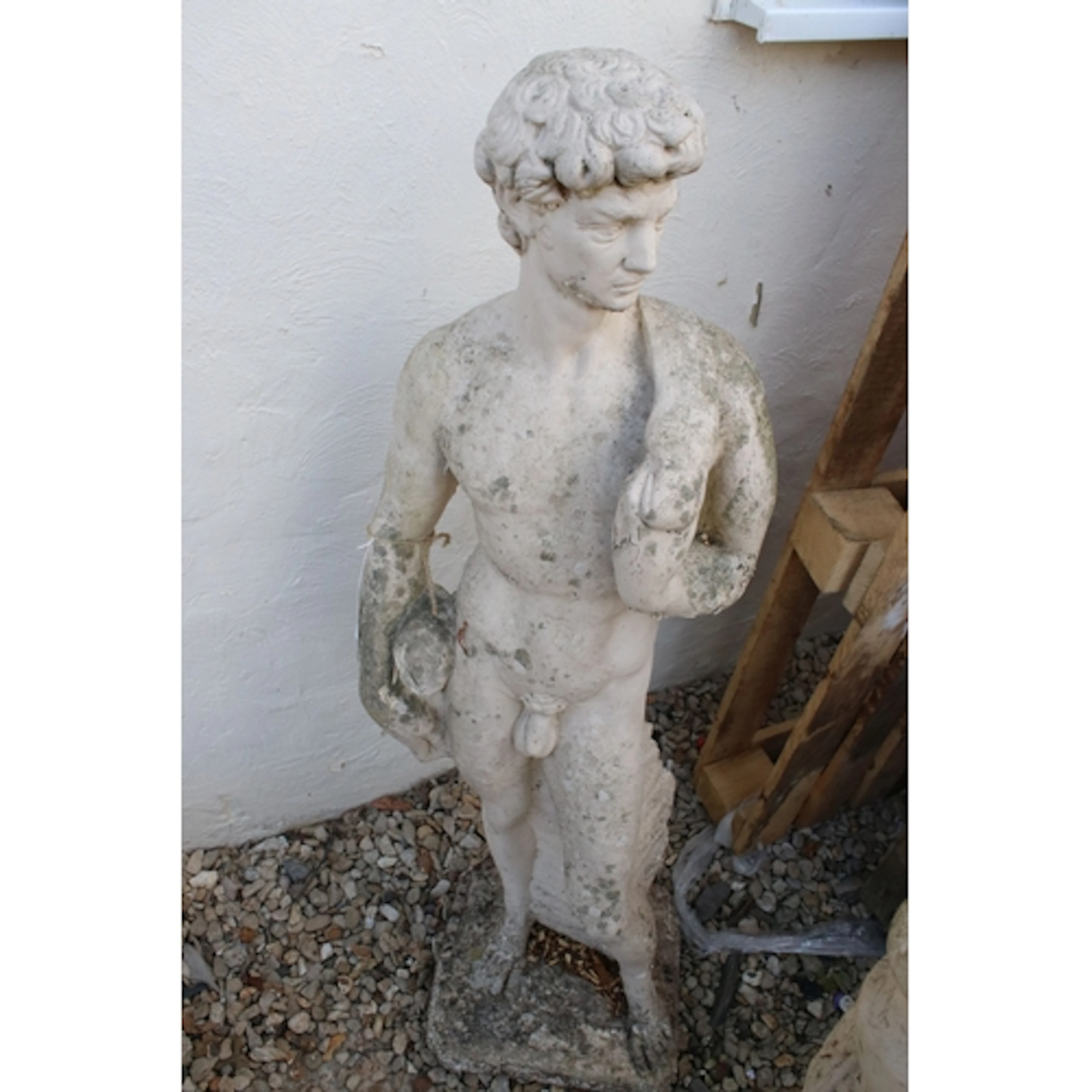 Reconstituted stone garden ornament of a classical nude man ...