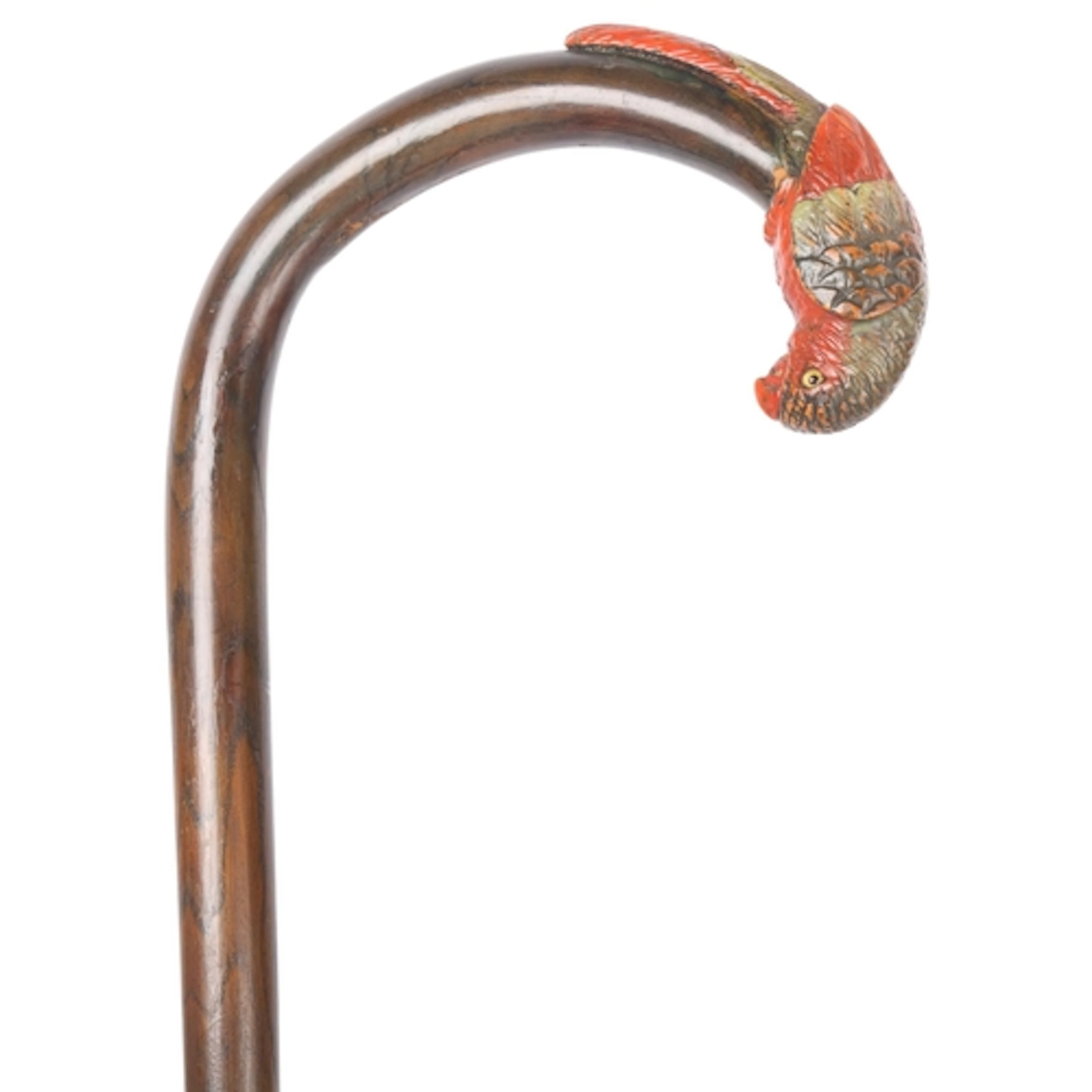 An antique crook-handled cane with a full parrot terminal, t...