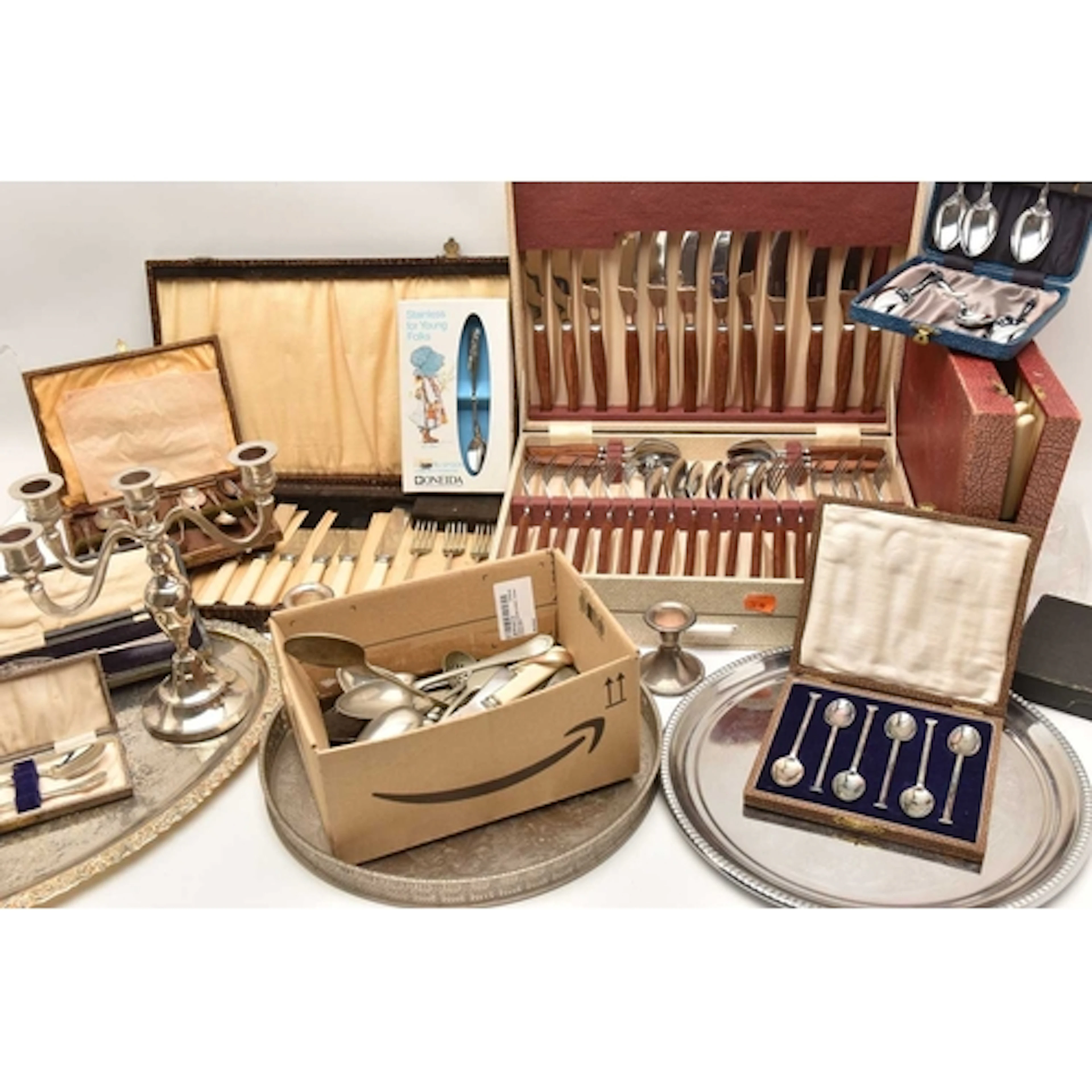 AN ASSORTMENT OF WHITE METAL AND CUTLERY, to include a selec...