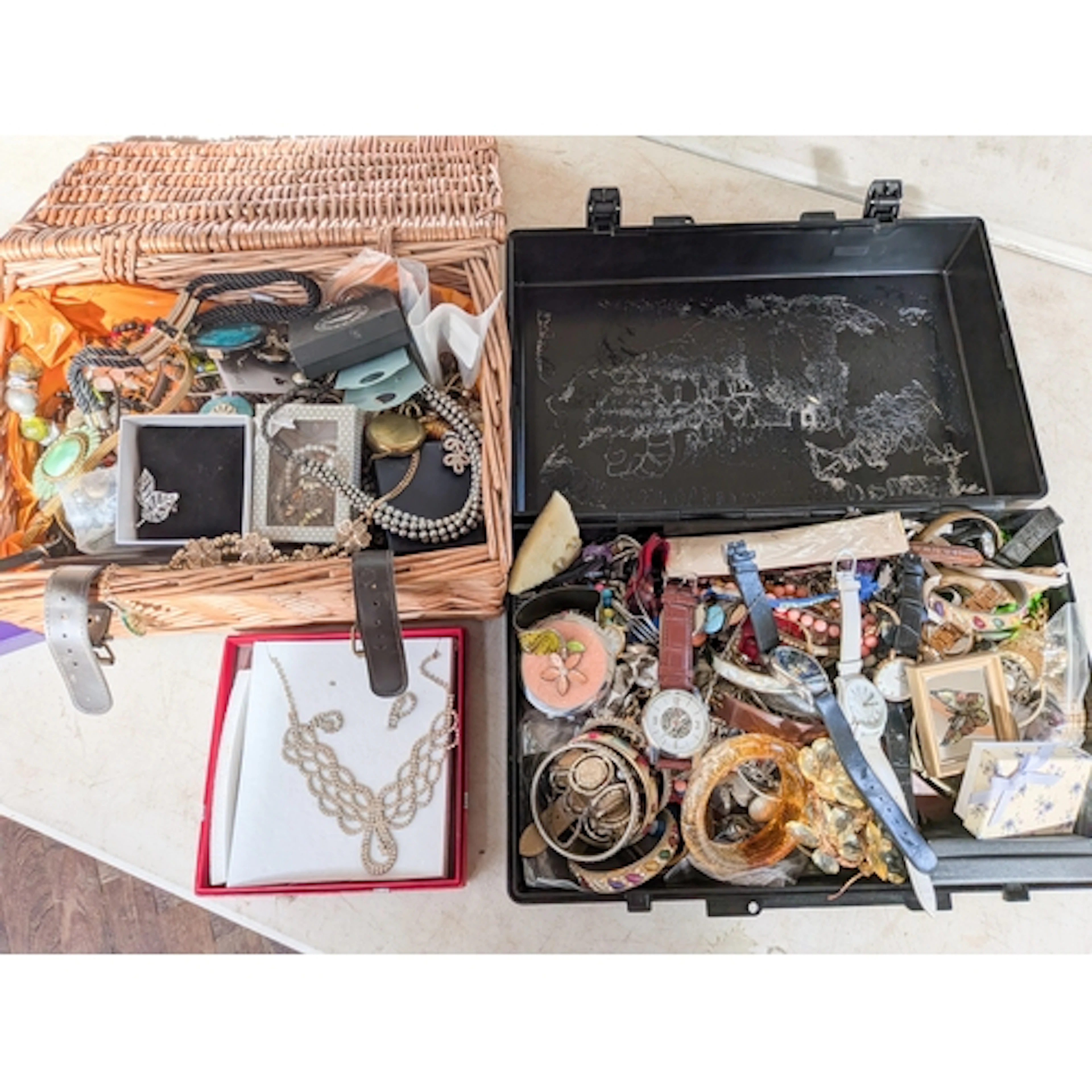Two cases of ladies costume jewellery to include dress watch...