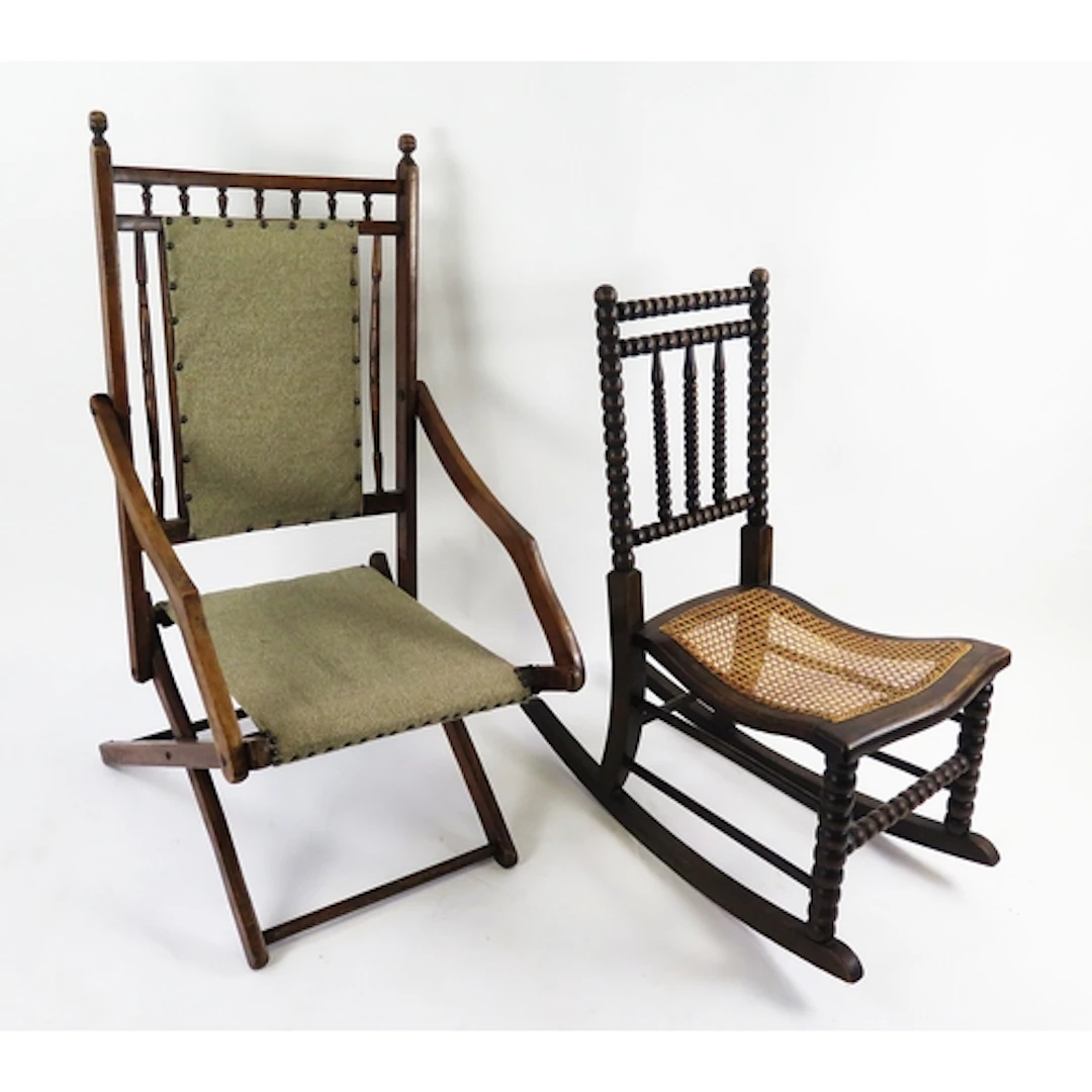 A small oak rocking chair, with bobbin turned back and caned...