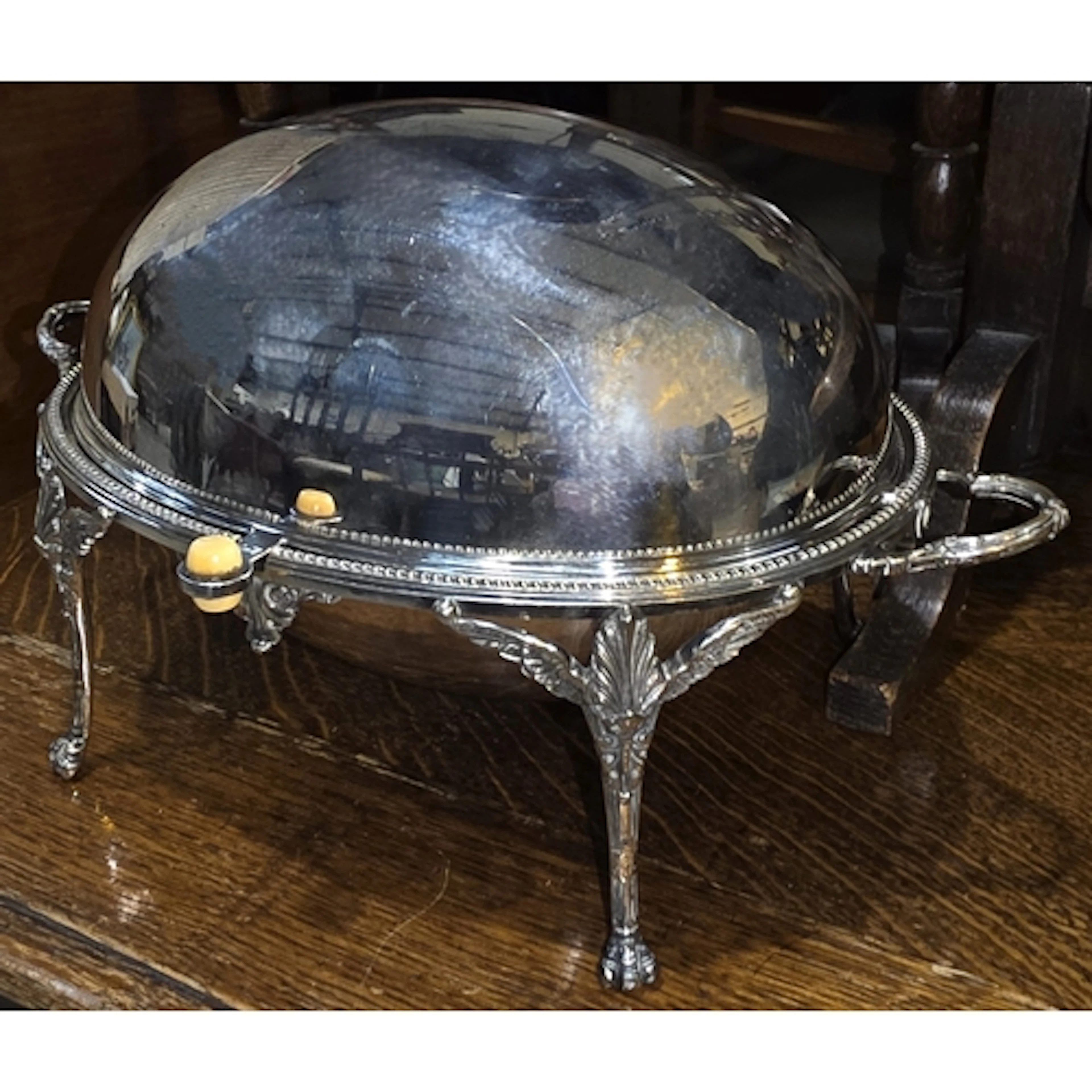 A silver plated roll dome top entree dish