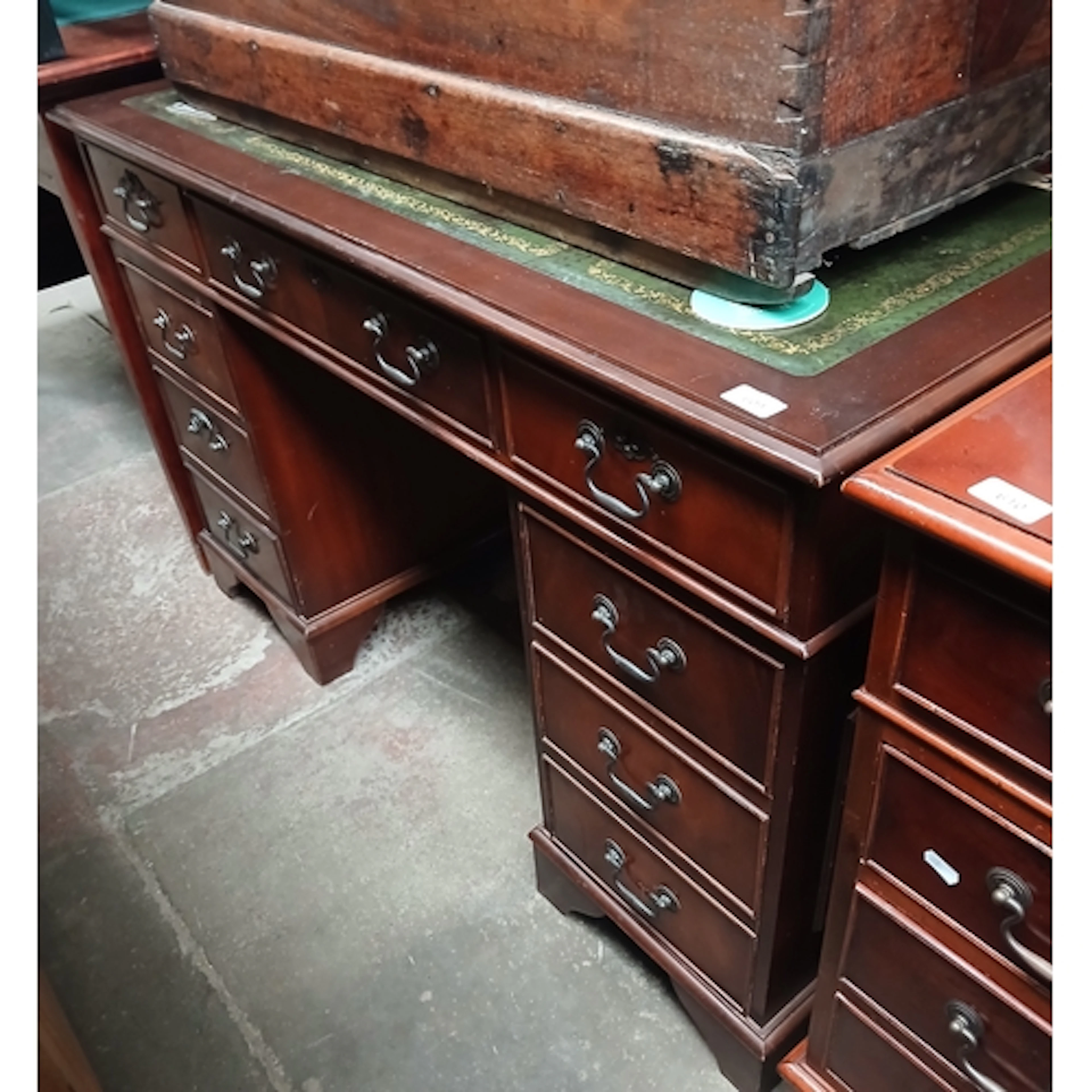A reproduction twin pedestal desk.