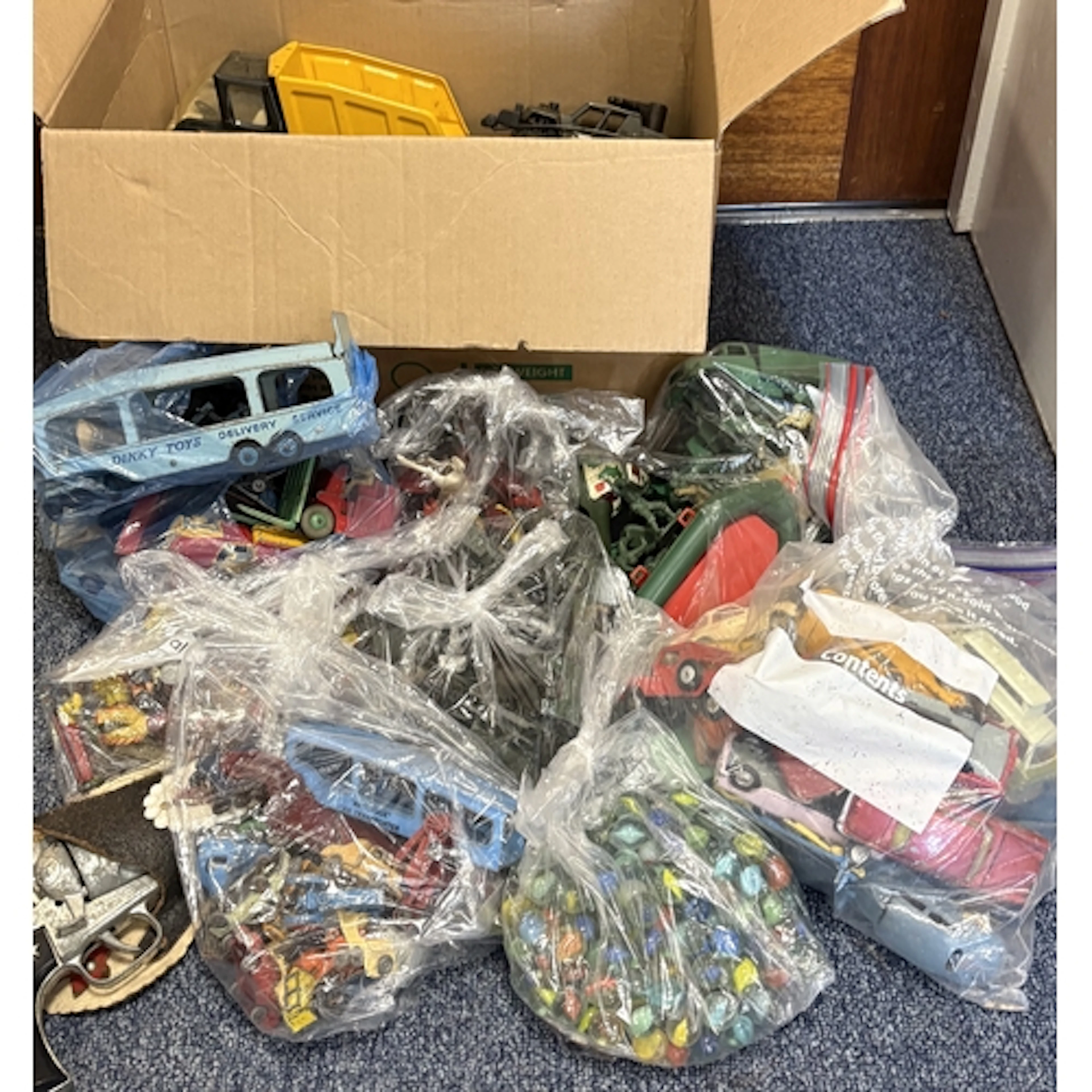 A box of vintage toys to include Tonka, Dinky, lead and plas...