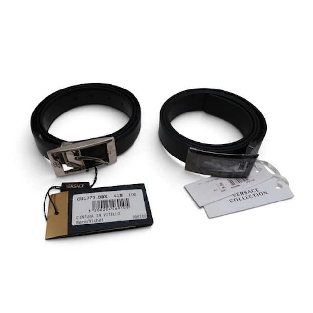 A Versace black leather belt with silver-tone buckle, togeth...