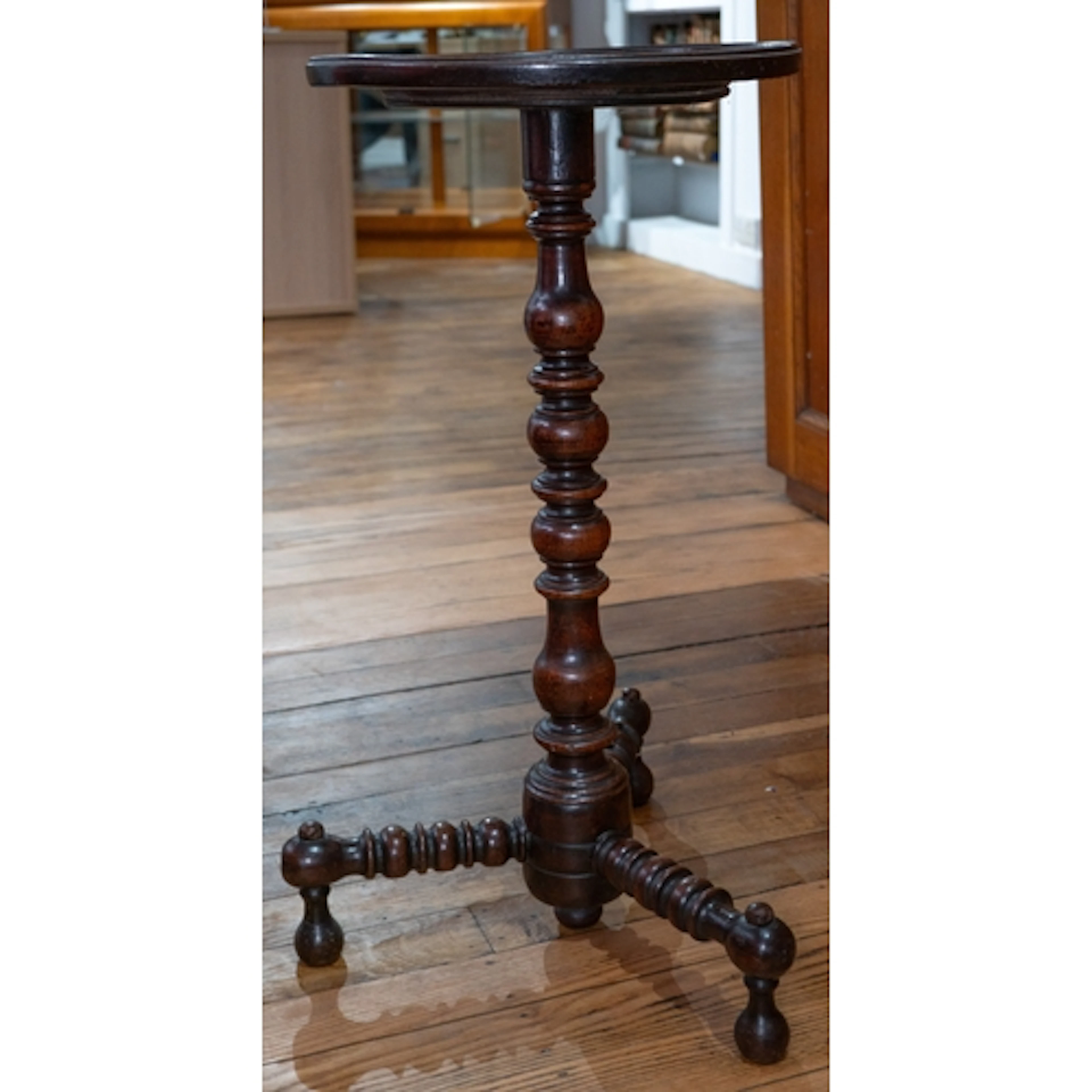 Furniture: 18th-century oak candle stand on turned bonnet an...