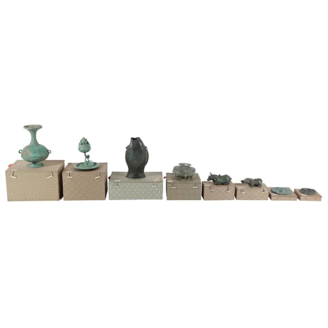 Eight Chinese patinated bronze archaistic models of a fish-s...