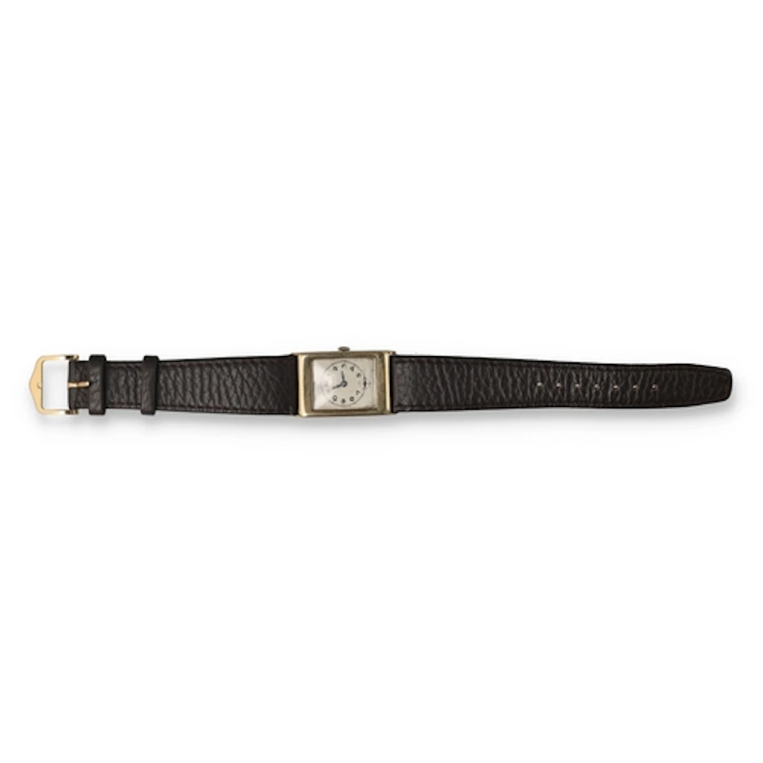 A 9CT GOLD CRUSADER WATCH With leather strap