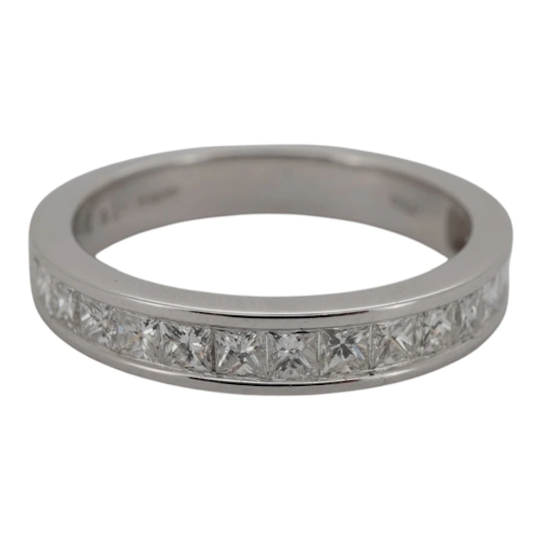 A diamond half eternity ring, channel-set to the front with ...