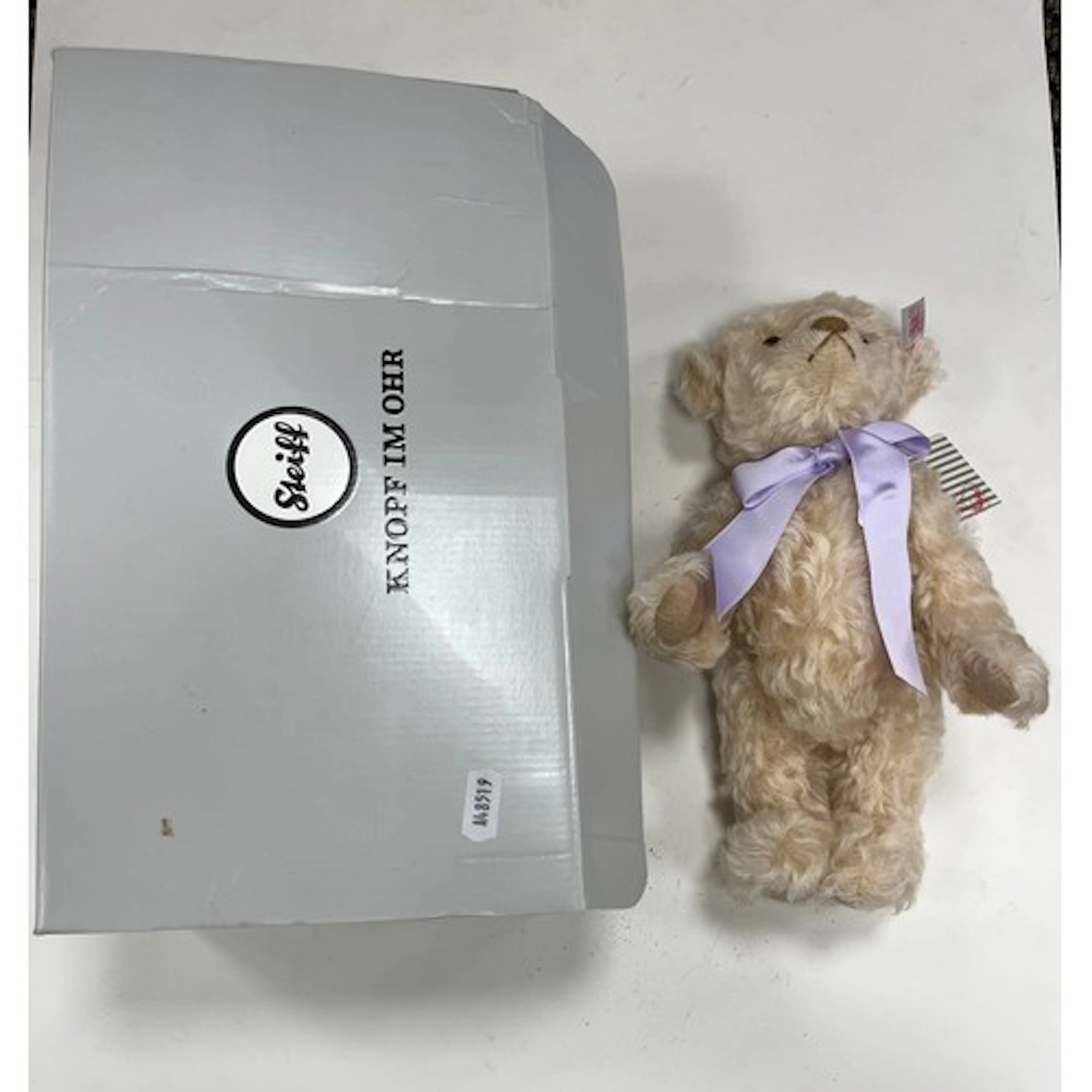 Steiff Knope Im Ohr teddy bear with purple ribbon, boxed.