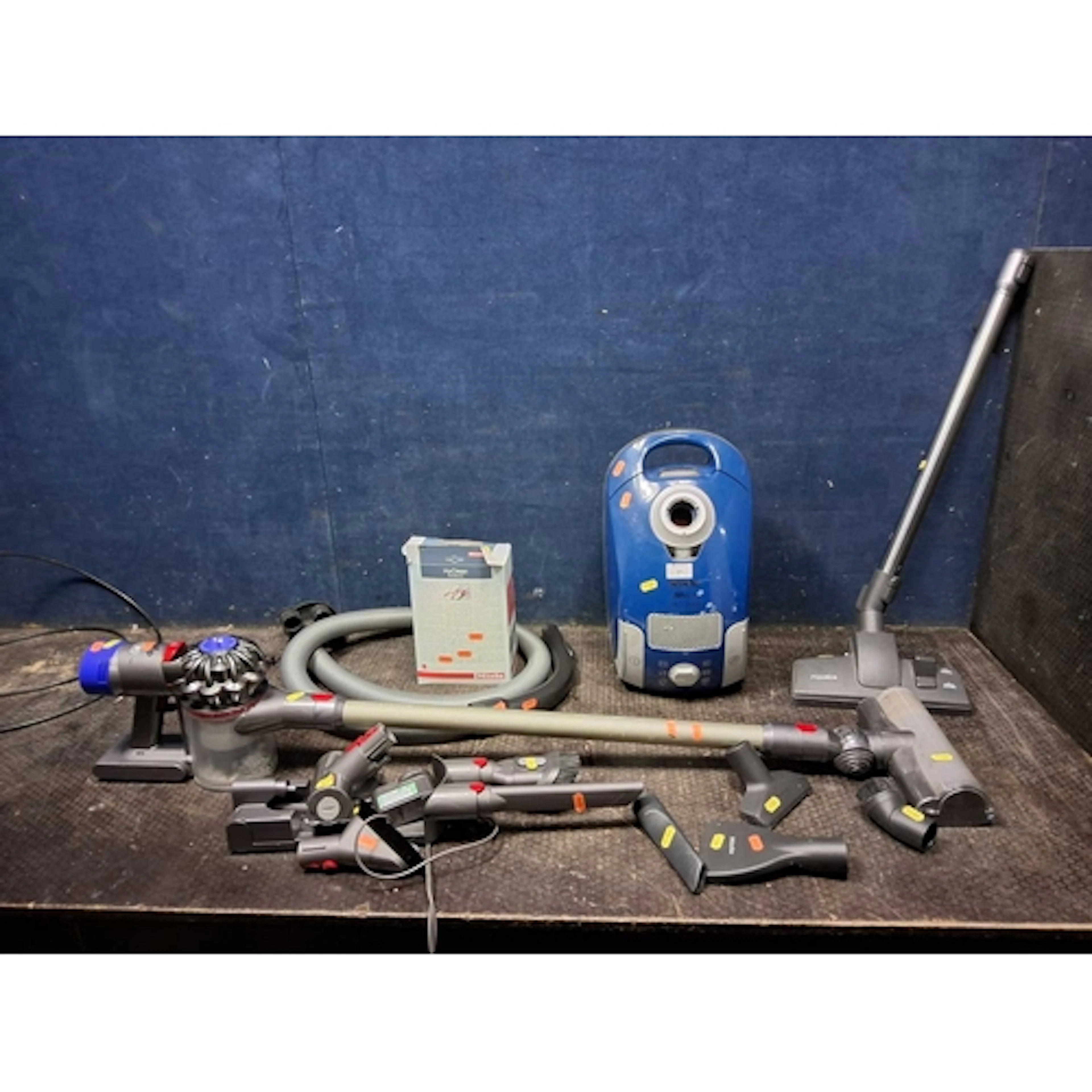 A MIELE S4 212 VACUUM CLEANER with some accessories and a Dy...