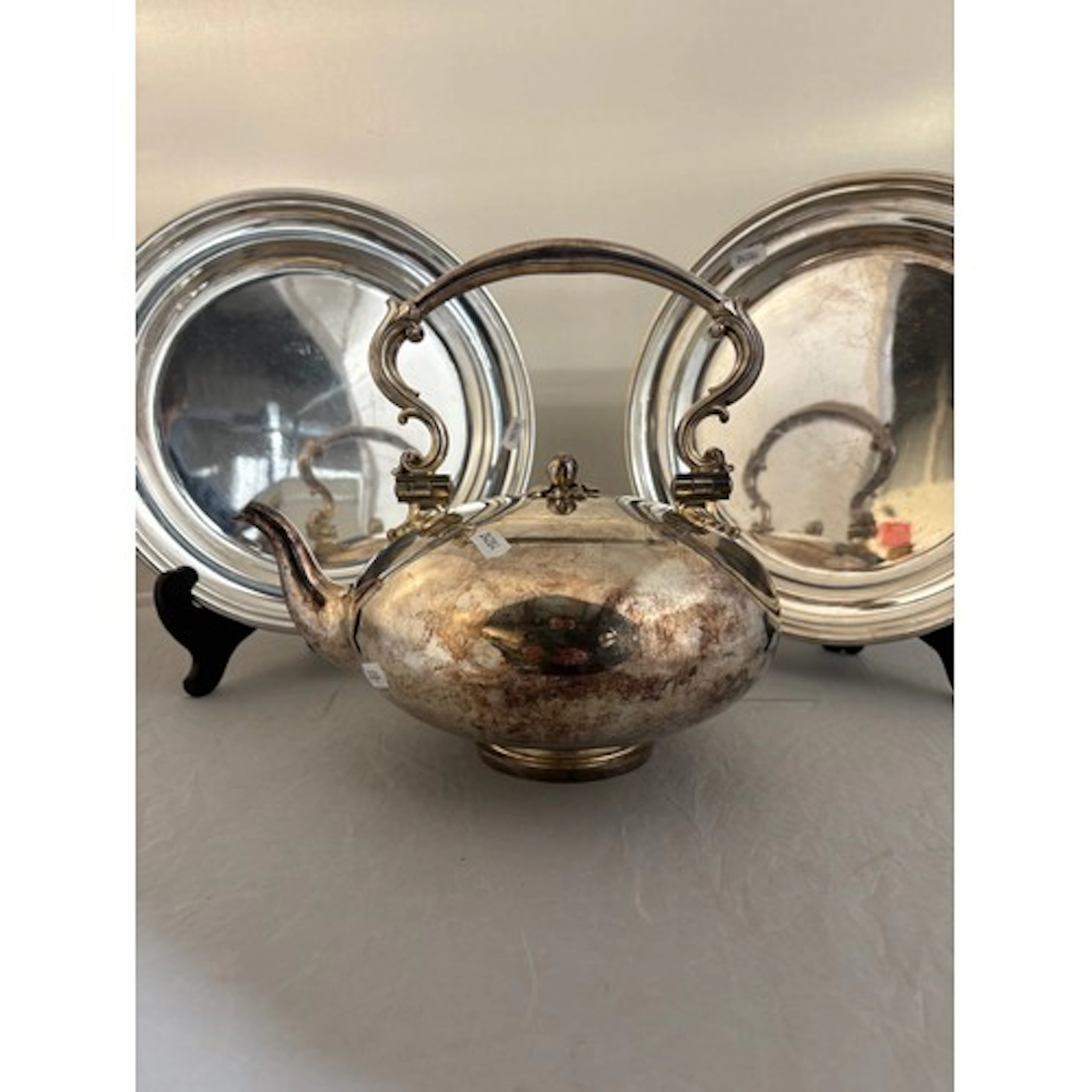 A large silver plate Ellington tea pot together with two ser...