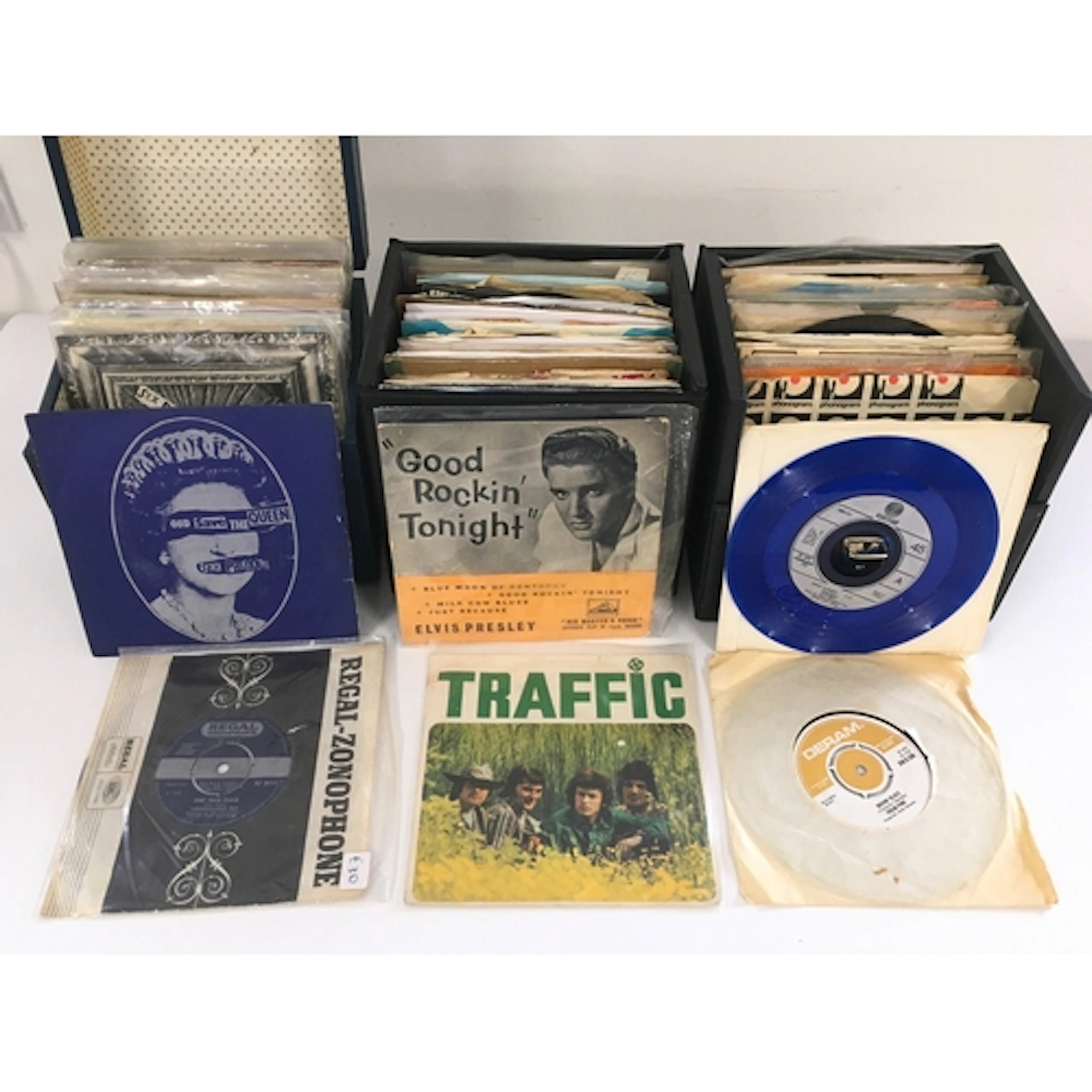 Three record cases of 7" singles and EPs by various artists ...