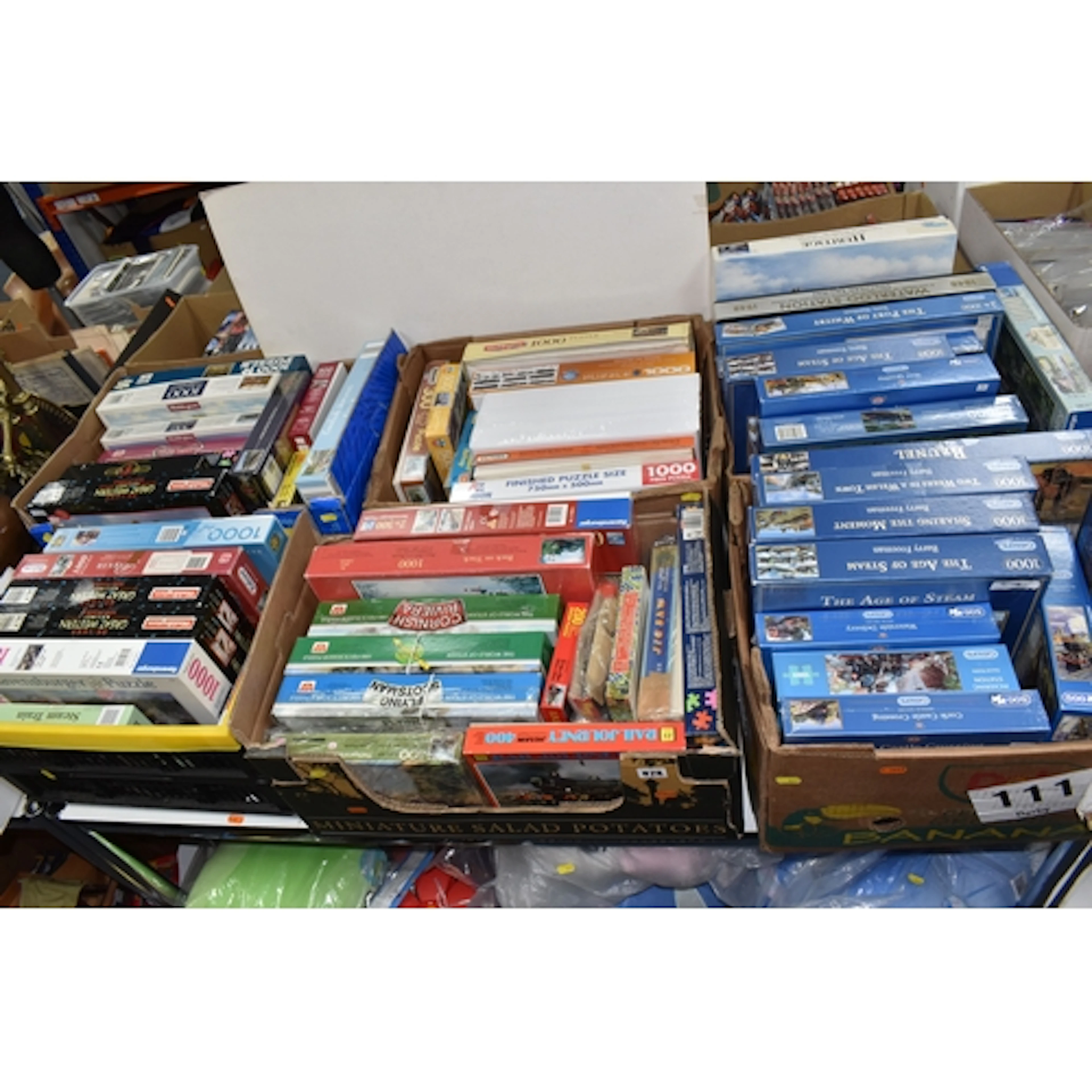 SIX BOXES OF JIGSAW PUZZLES comprising approximately sixty j...