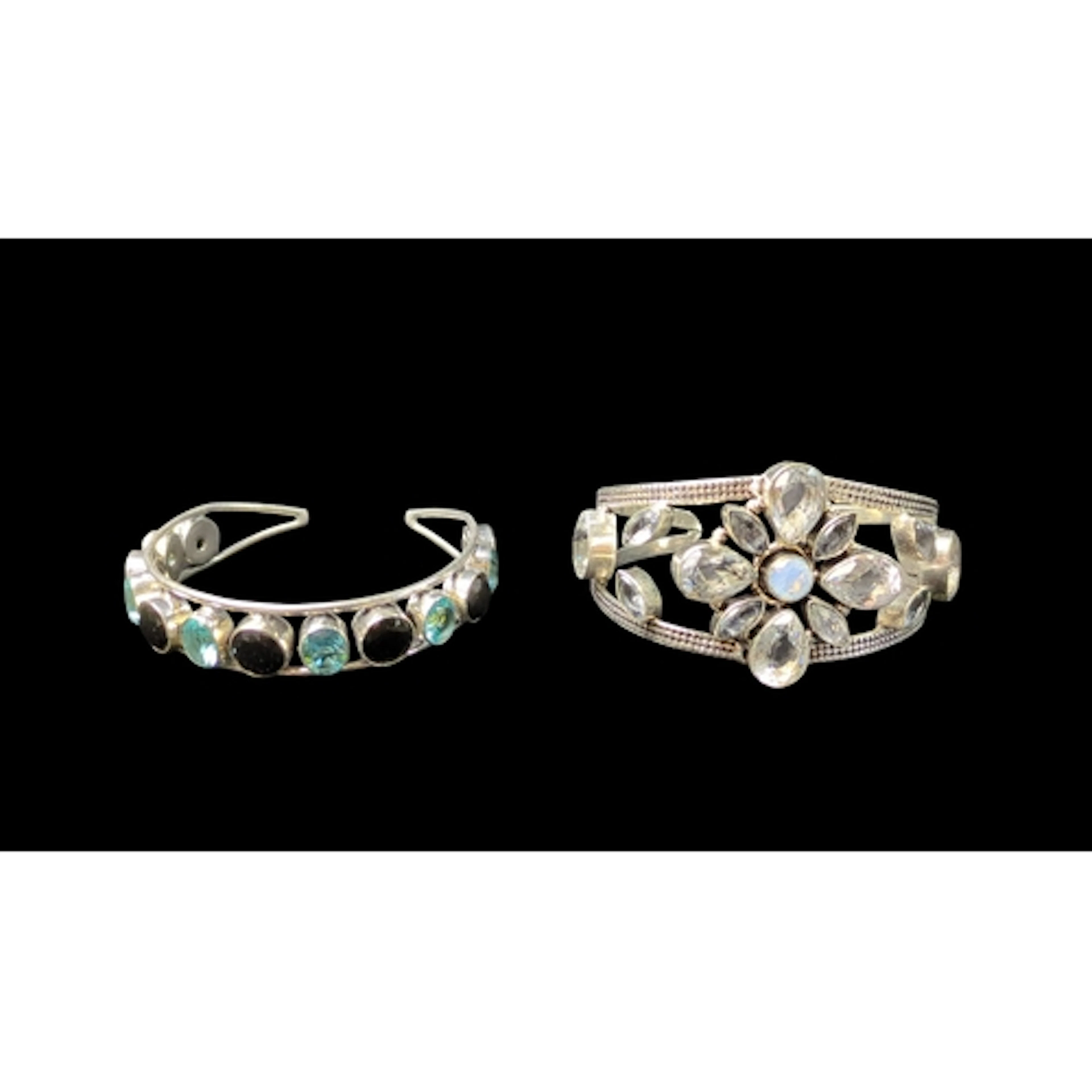 A pair of 925 silver open cuff bangles, one set with alterna...