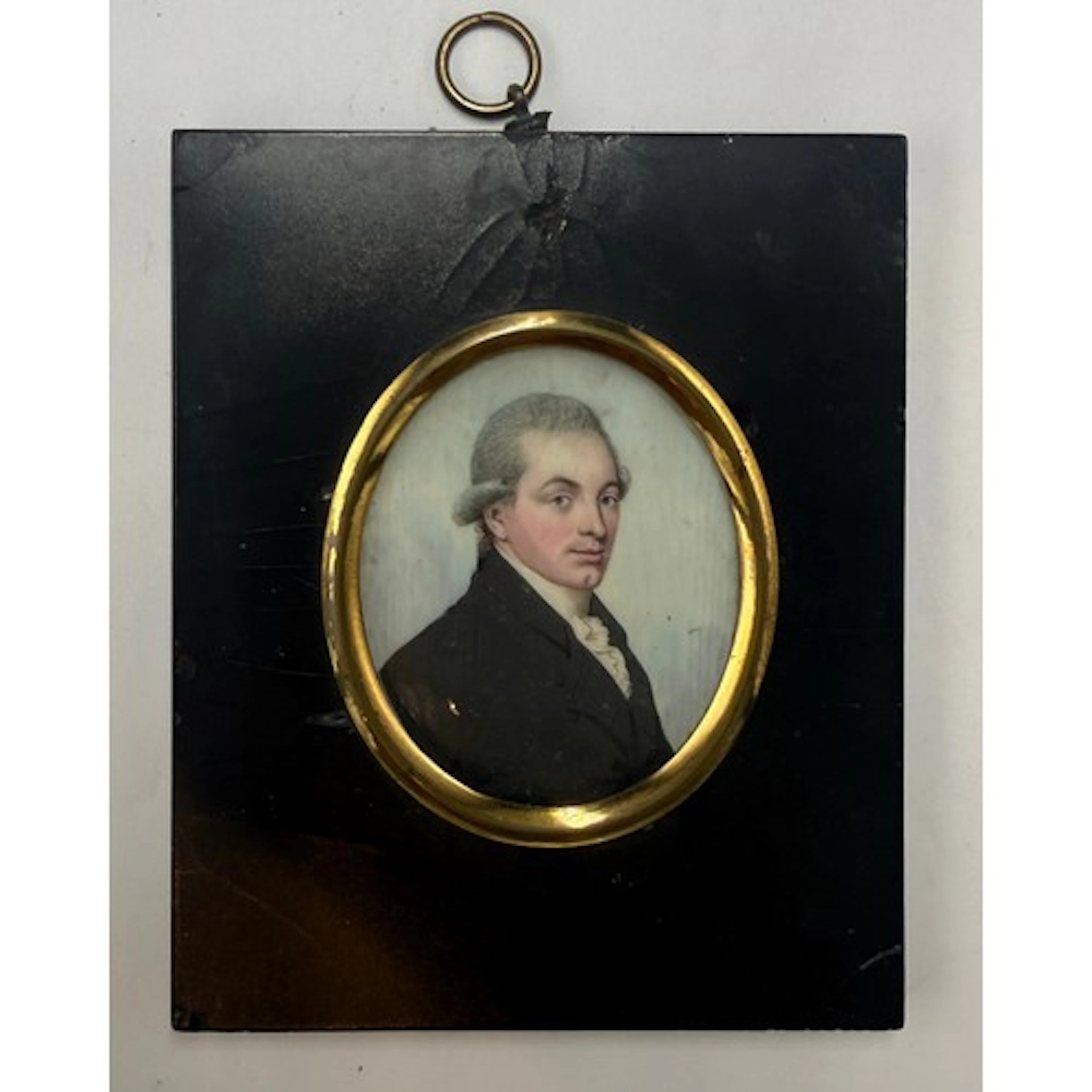 A painted miniature on ivory depicting a Georgian gentleman....