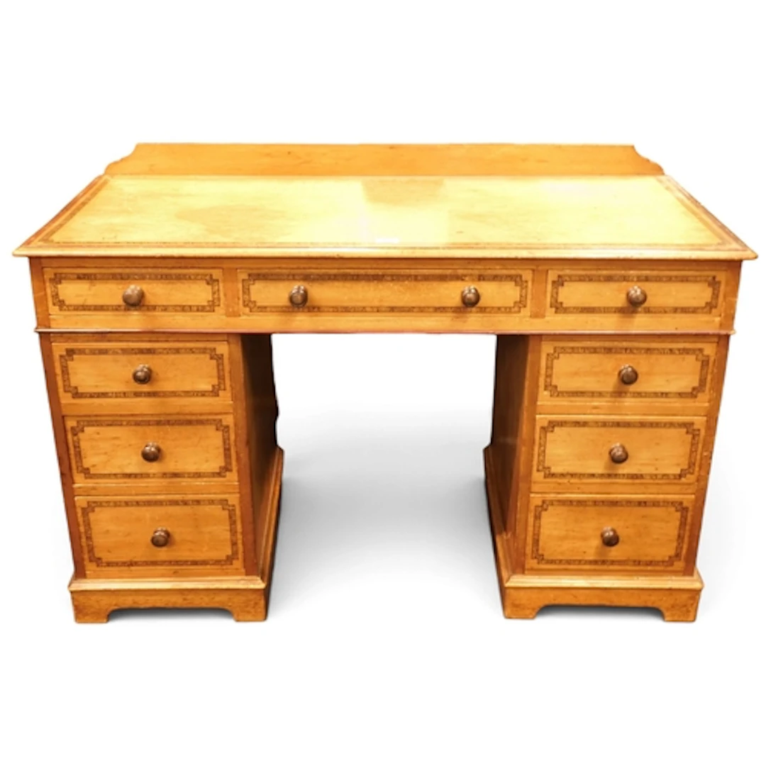 A 19th century Scumbled pine pedestal desk with long central...