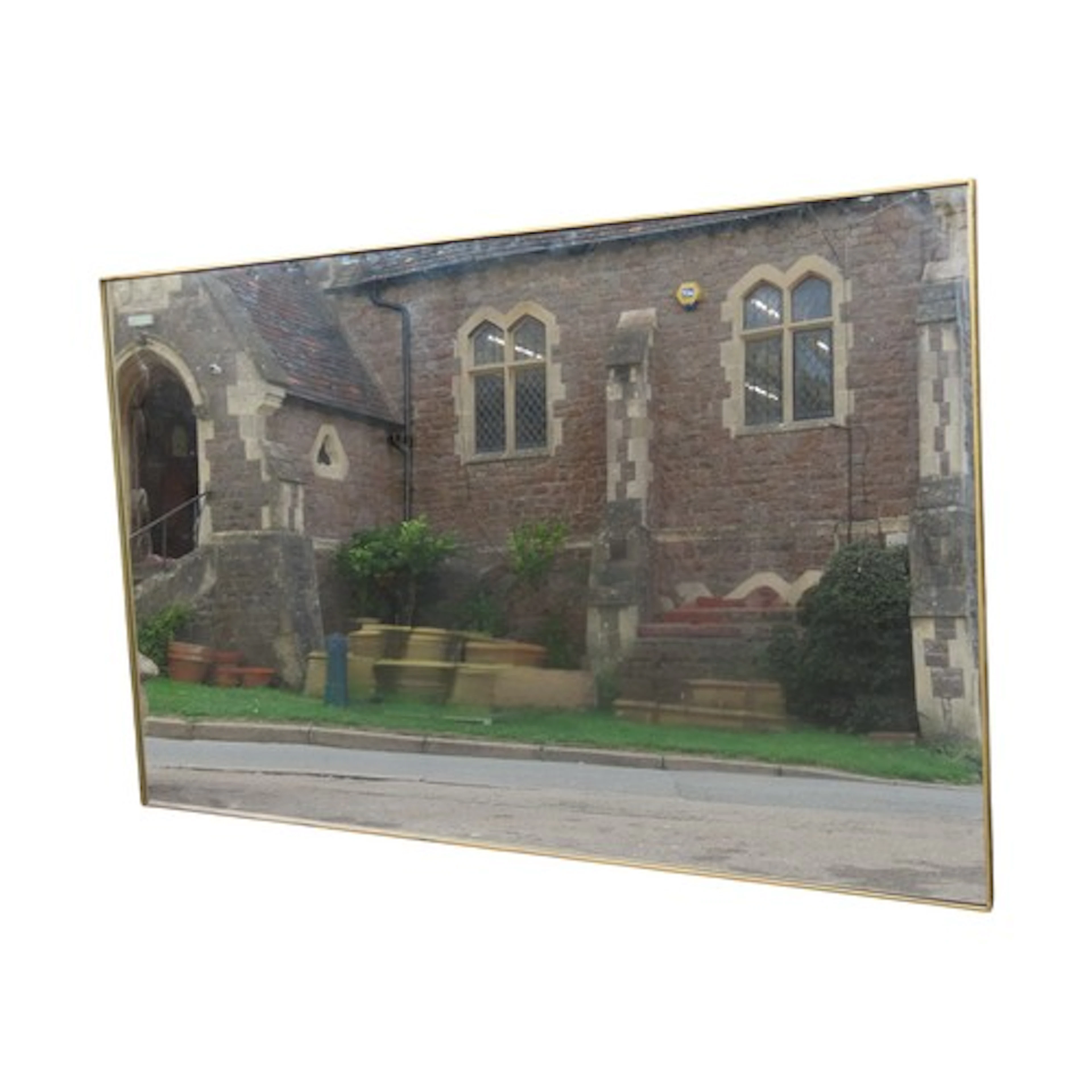 A large modern rectangular mirror with gold coloured frame, ...