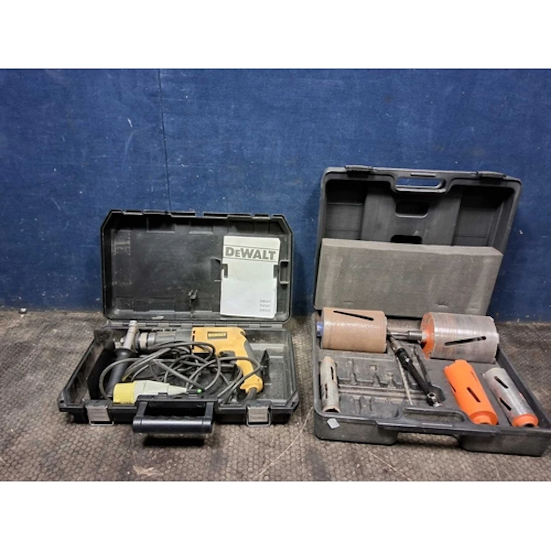 A DeWALT DW505L XW 110V HAMMER DRILL in case and a case core...
