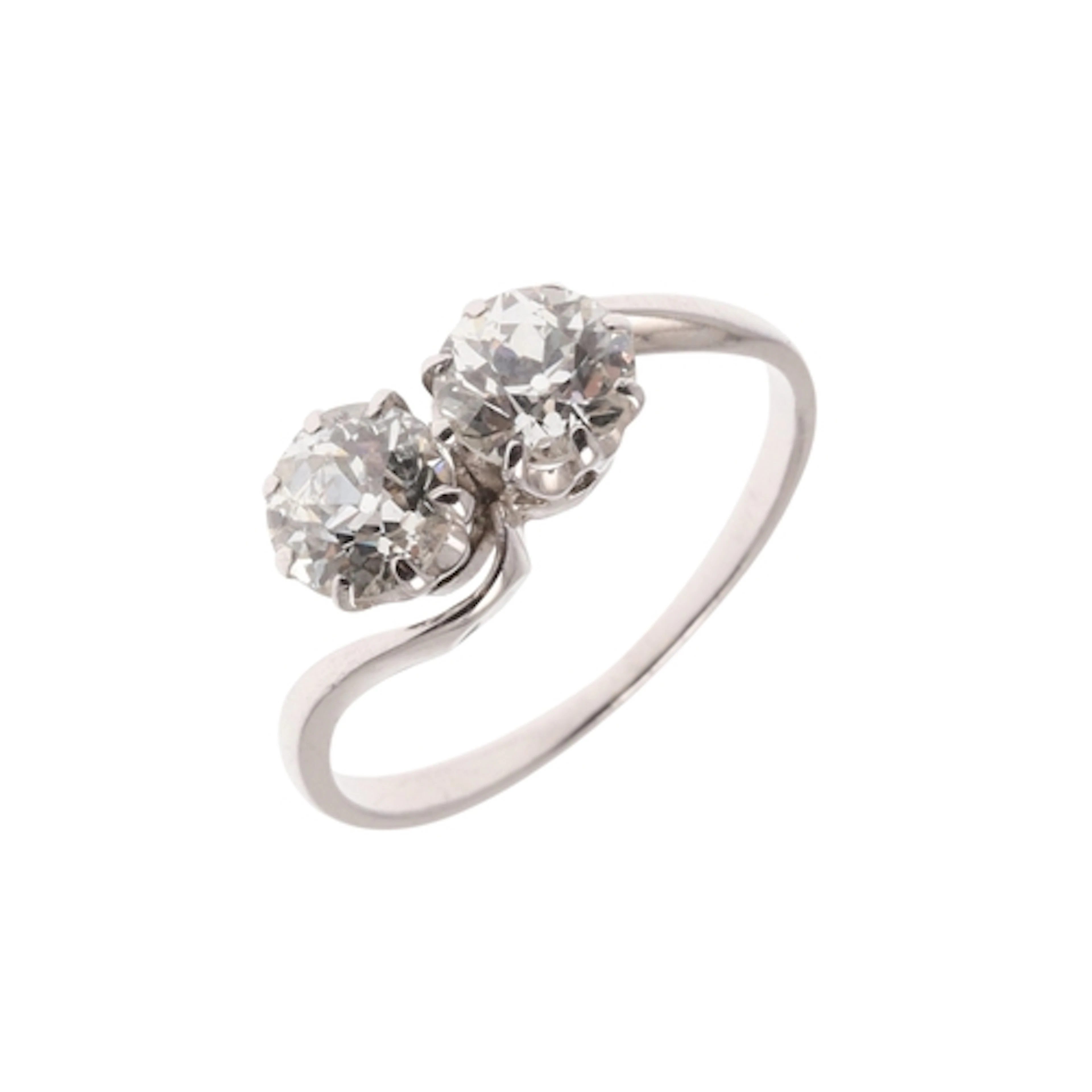 A DIAMOND TWO STONE CROSS-OVER RING. mounted with two old-cu...