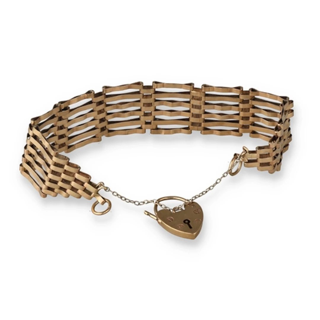 A 9CT GOLD GATE BRACELET With heart charm, 13.4gms ...