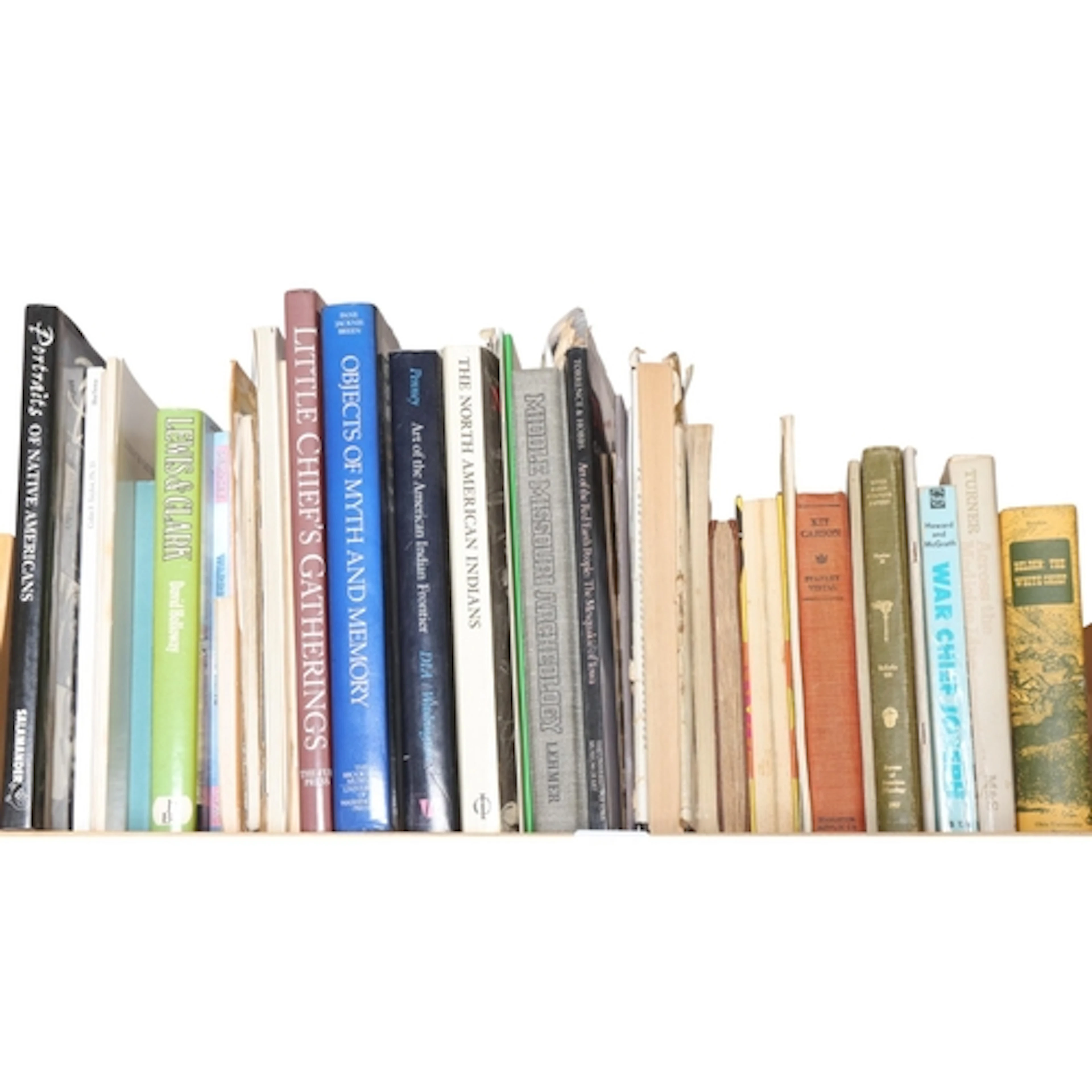 Two shelves of books to include: Indian Talk, Hand Signals o...