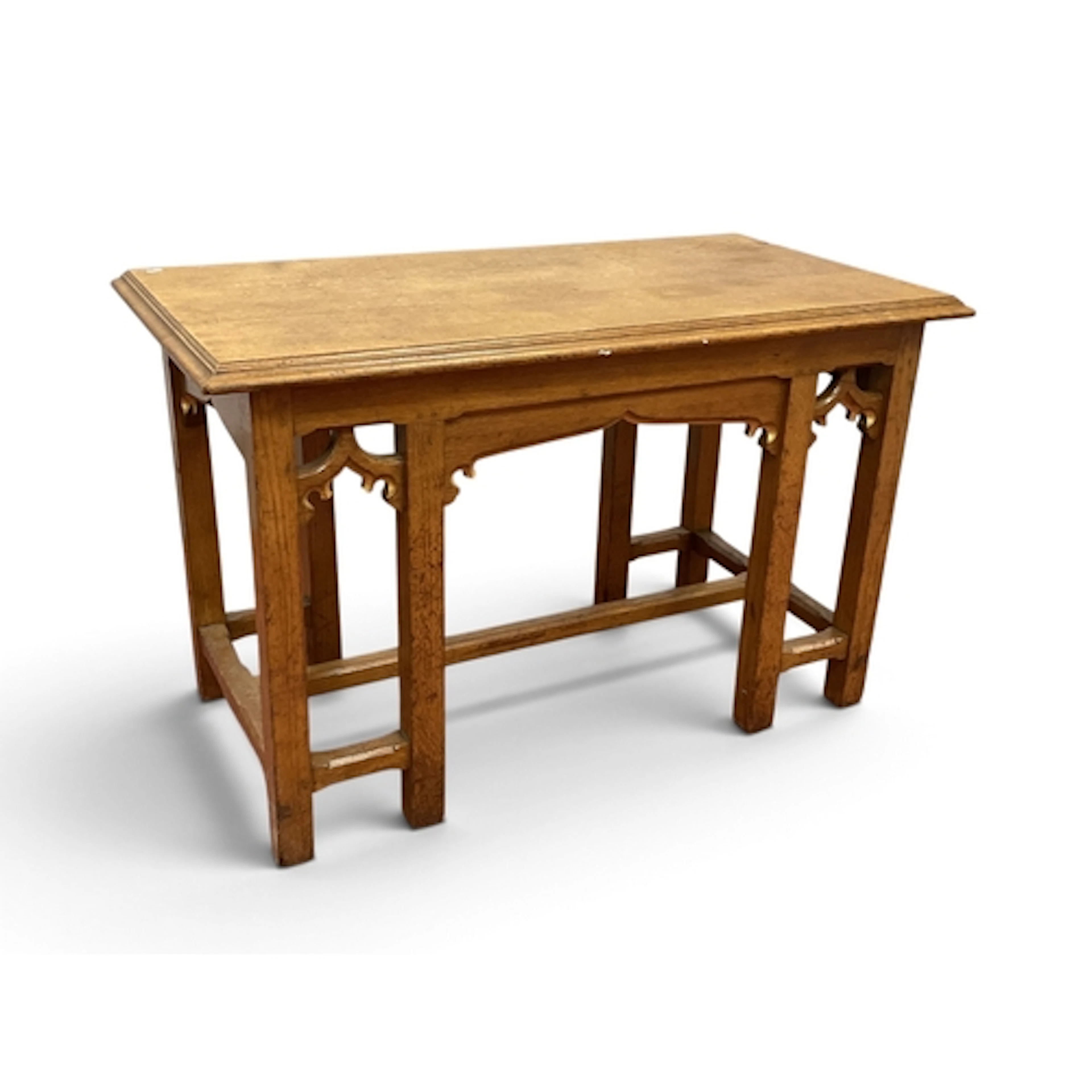 An Oak Gothic Table, with a rectangular top, moulded edge on...