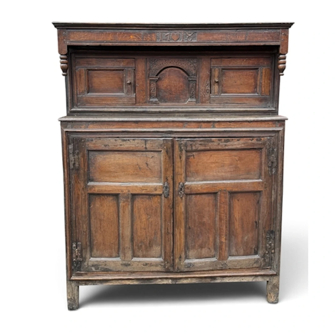 AN EARLY 18TH CENTURY OAK COURT CUPBOARD, OF PANELLED CONSTR...