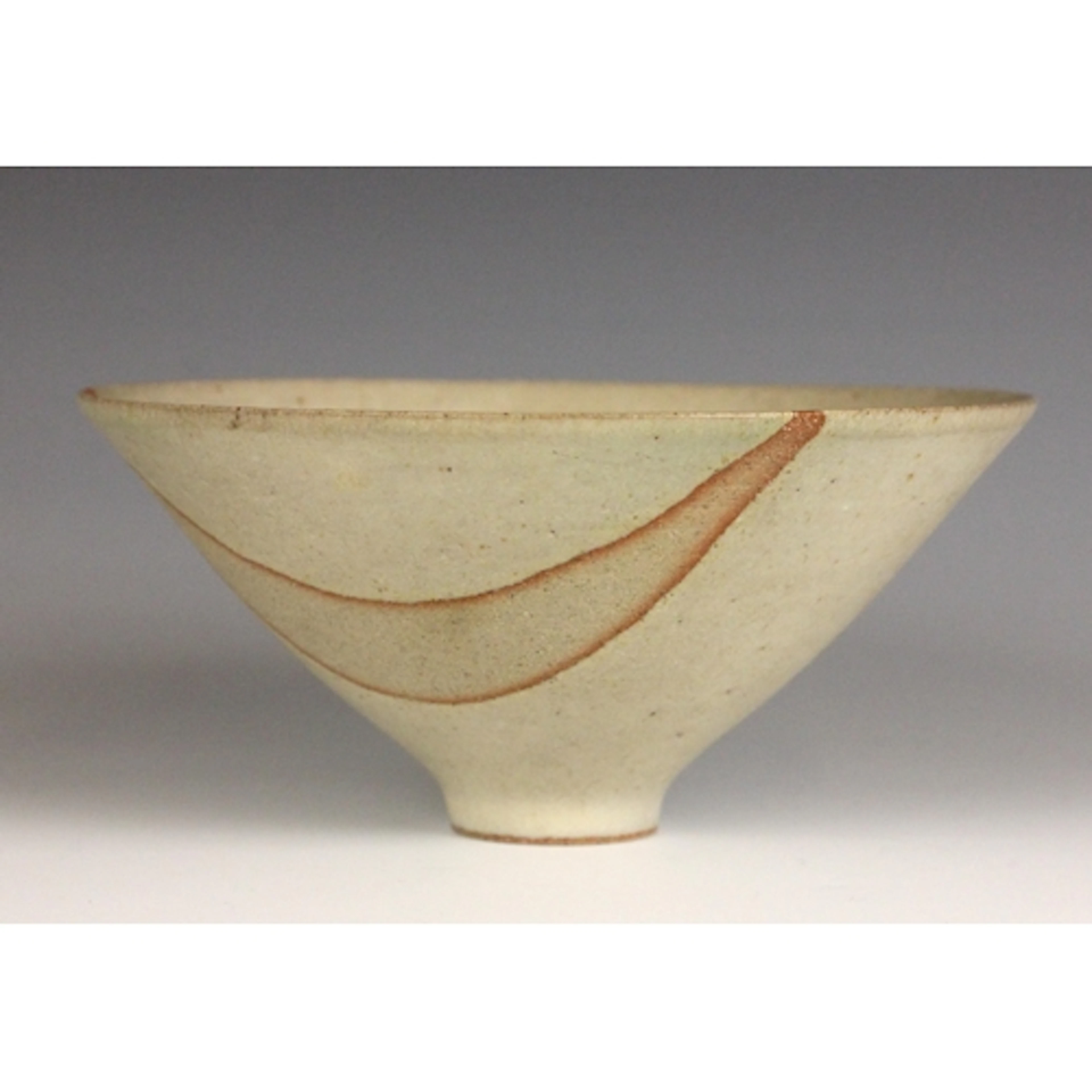 A studio pottery bowl in the manner of Lucie Rie, the stonew...