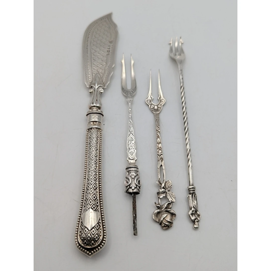 Silver to include a fish knife, along with three pickle fork...