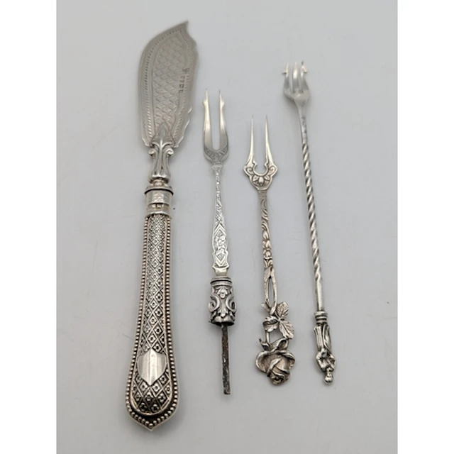 Silver to include a fish knife, along with three pickle fork...