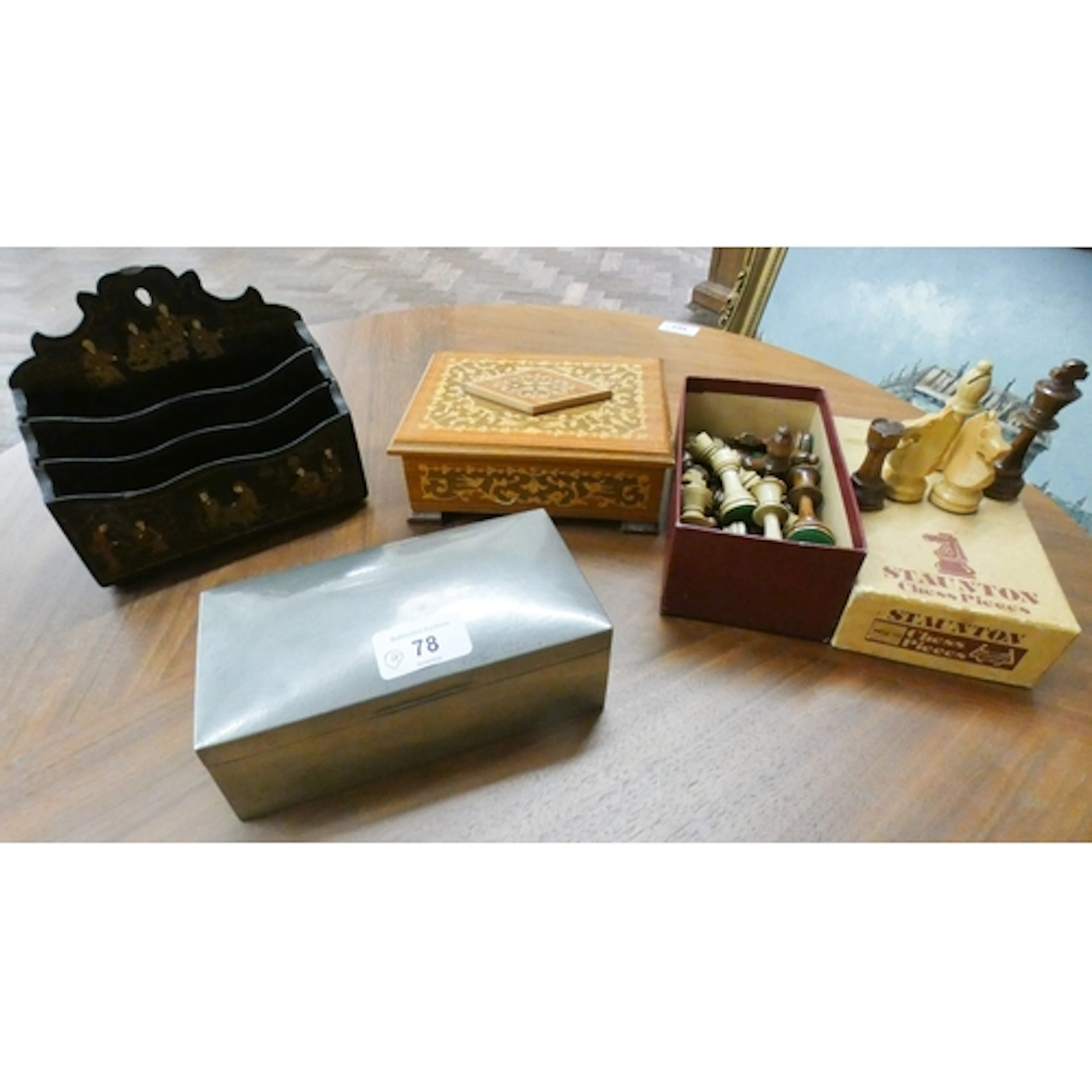 A Liberty's pewter cigarette box together with an inlaid woo...