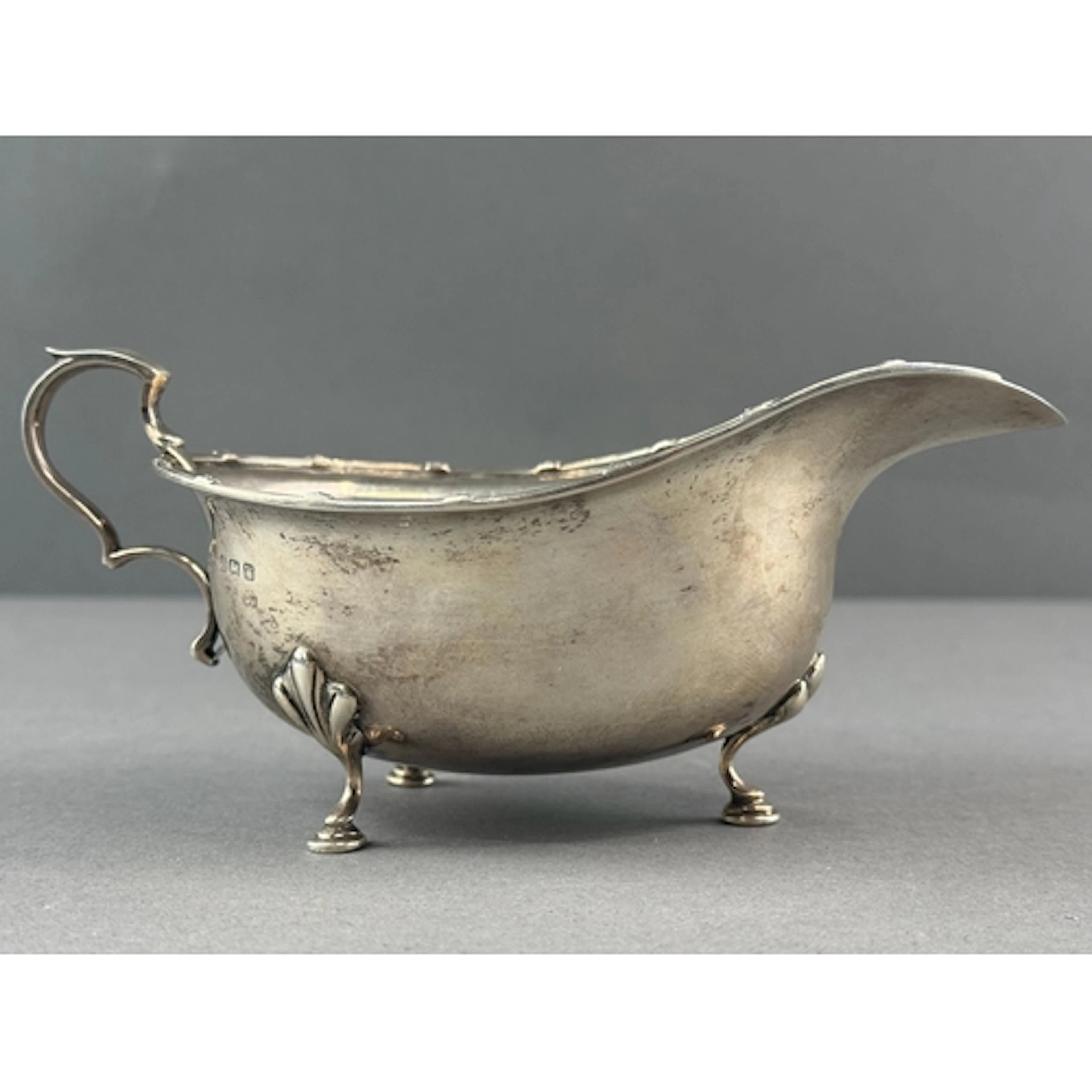 Silver: an oval sauceboat by E S Barnsley & Co, Birmingh...