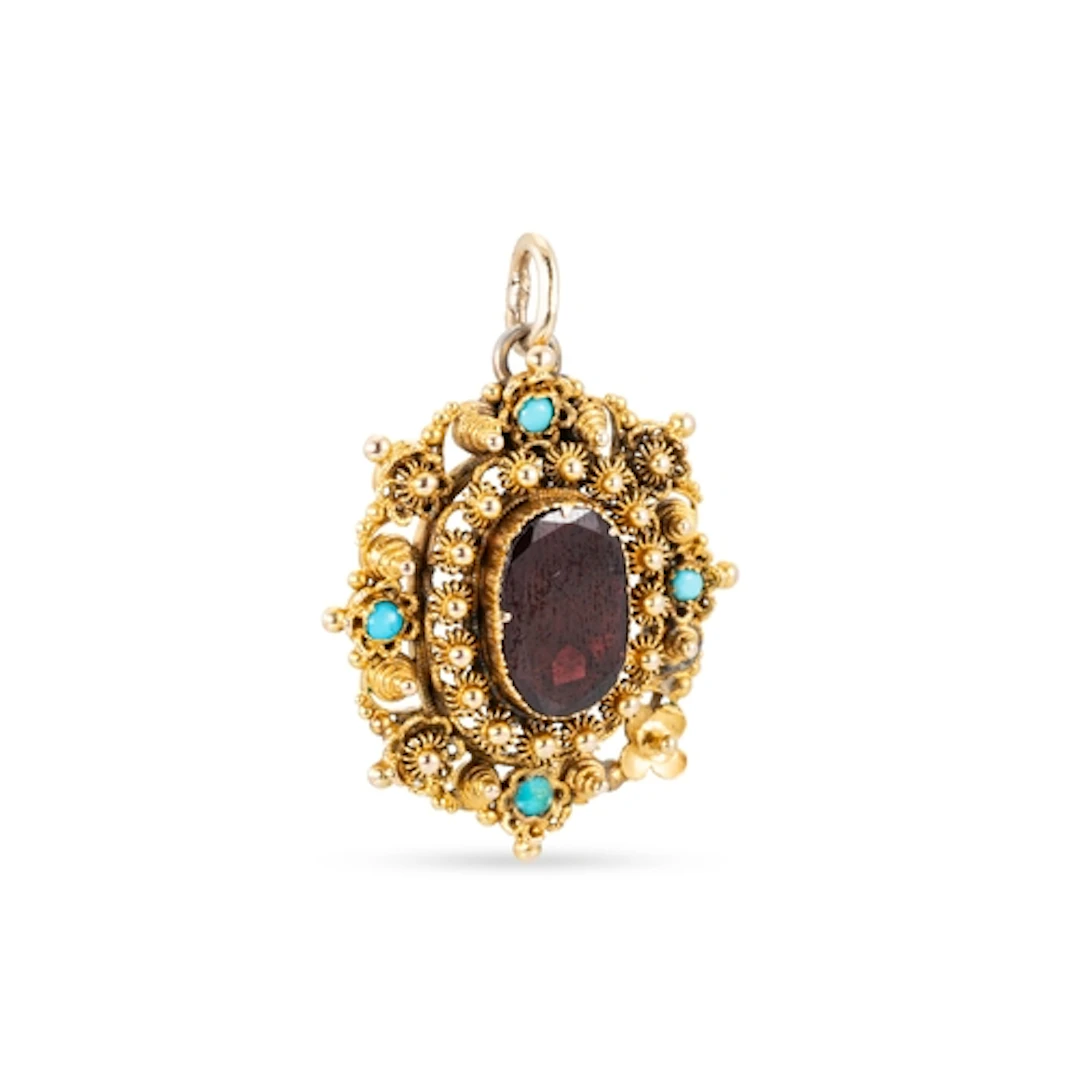 AN ANTIQUE FOIL BACKED CANETTILLE WORK PENDANT, turquoise se...