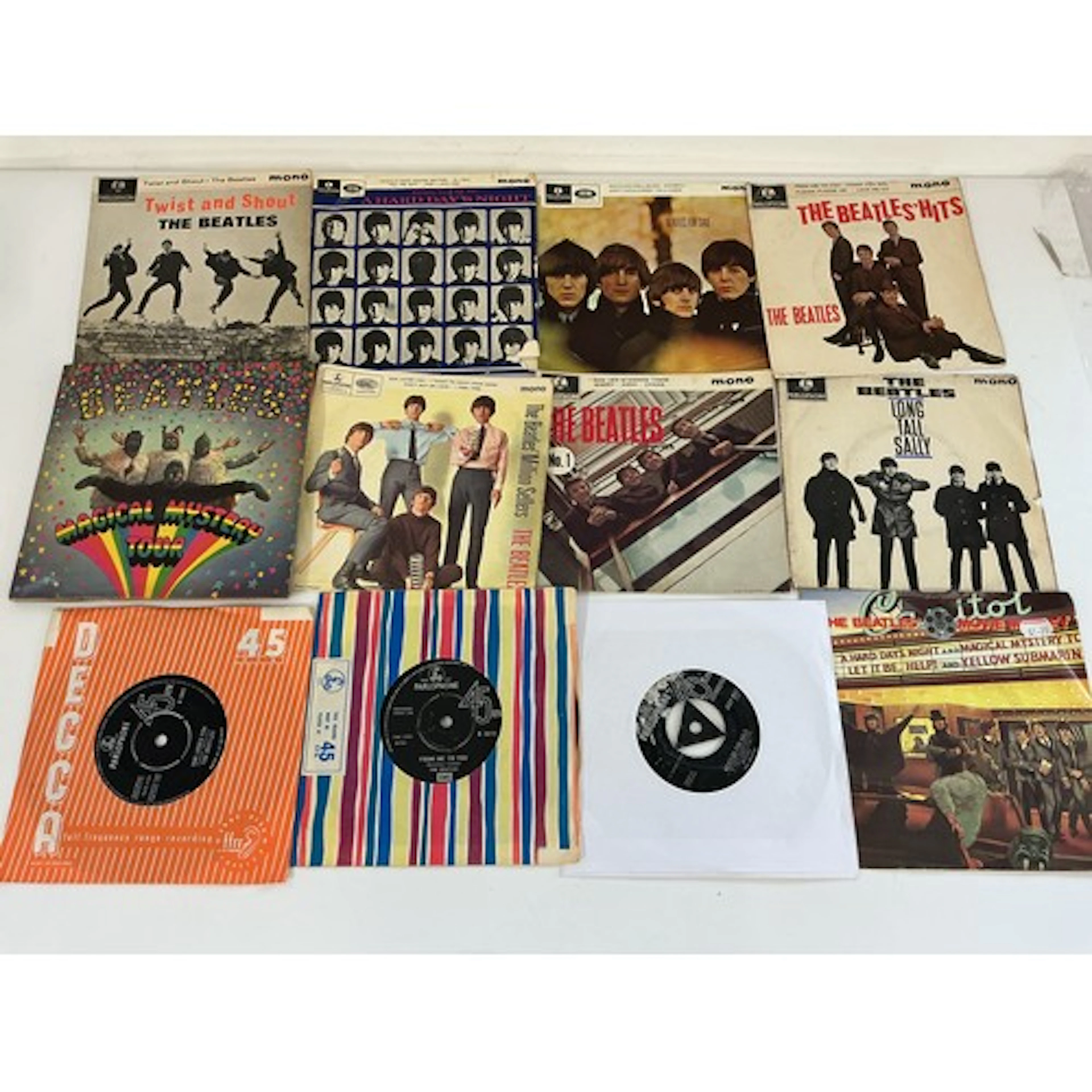 A collection of Beatles 7” singles and EPS comprising Beatle...