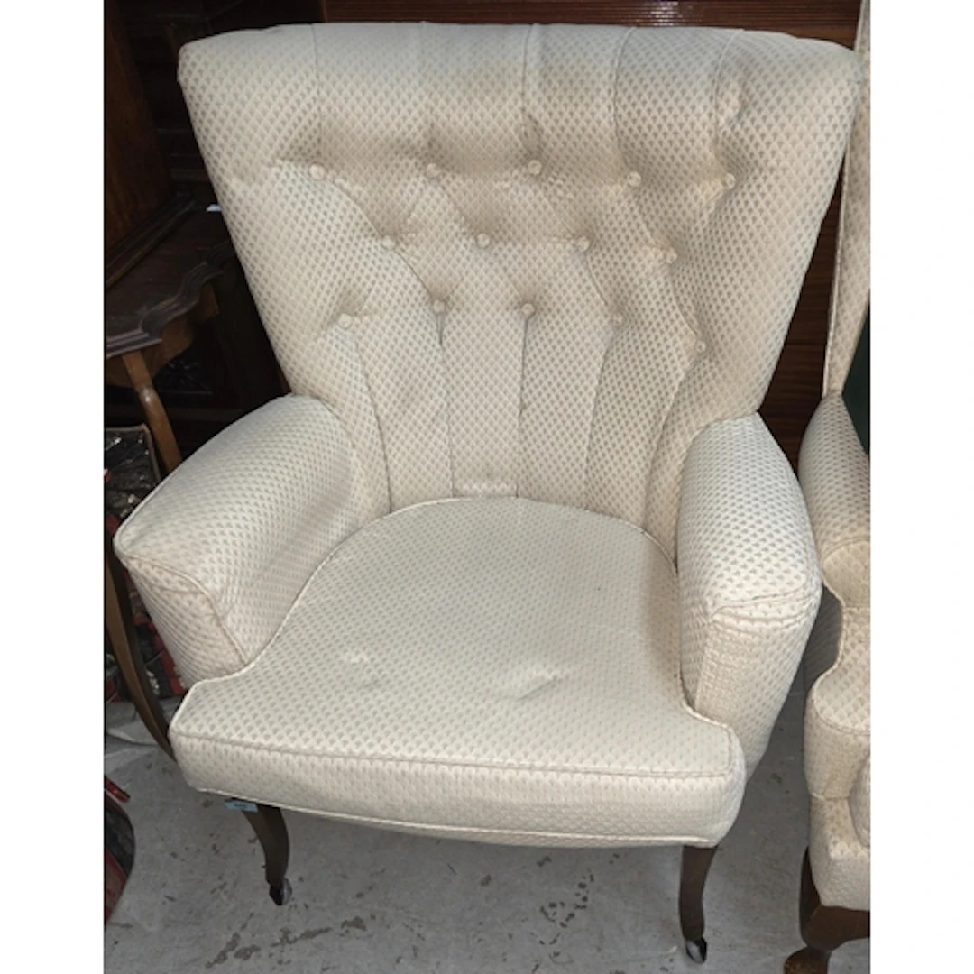 A button back armchair in Art Deco upholstery.